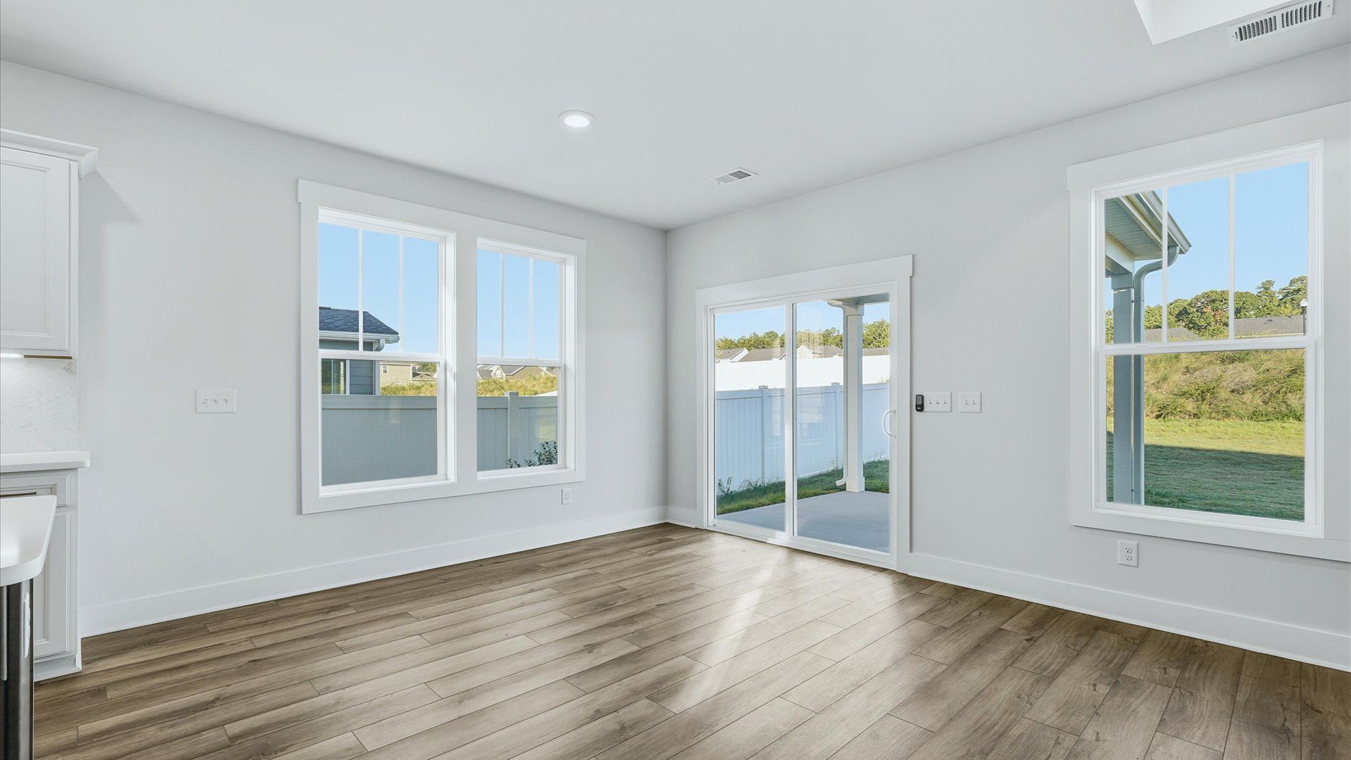 Light-filled breakfast area offering a comfortable space to gather and unwind at the Mulberry Estates community