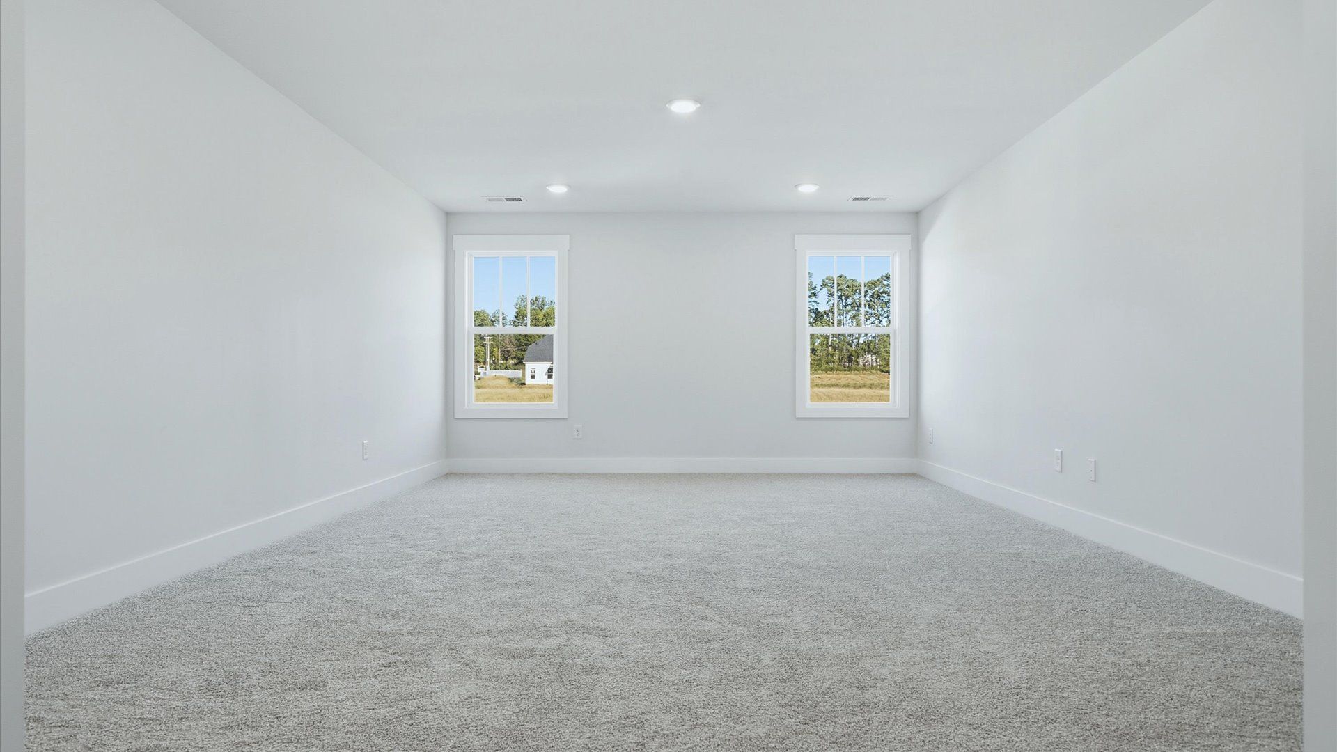 Vibrant carpeted bonus room offering flexibility as a study nook, game room, or second family space at Mulberry Estates