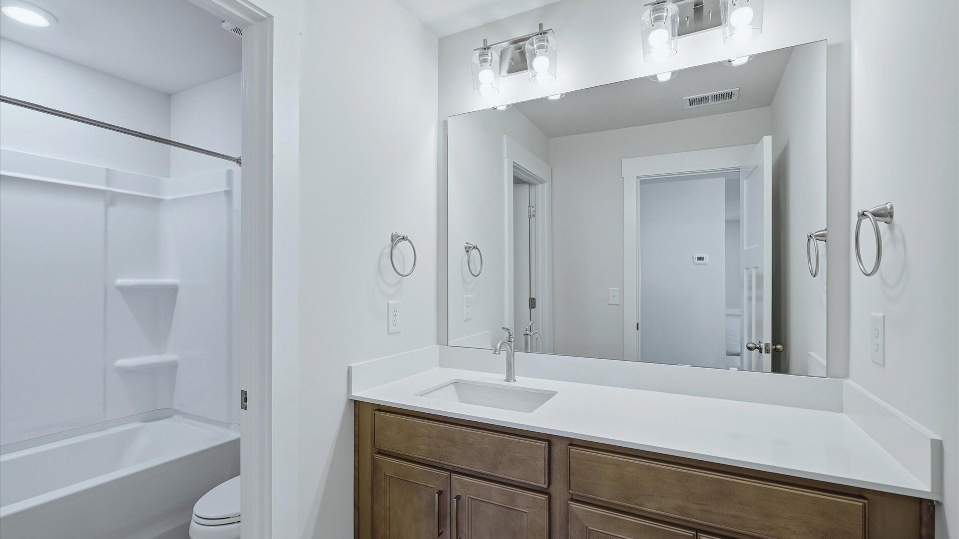 Well-appointed full bath with high standards of craftsmanship and everyday function at Mulberry Estates