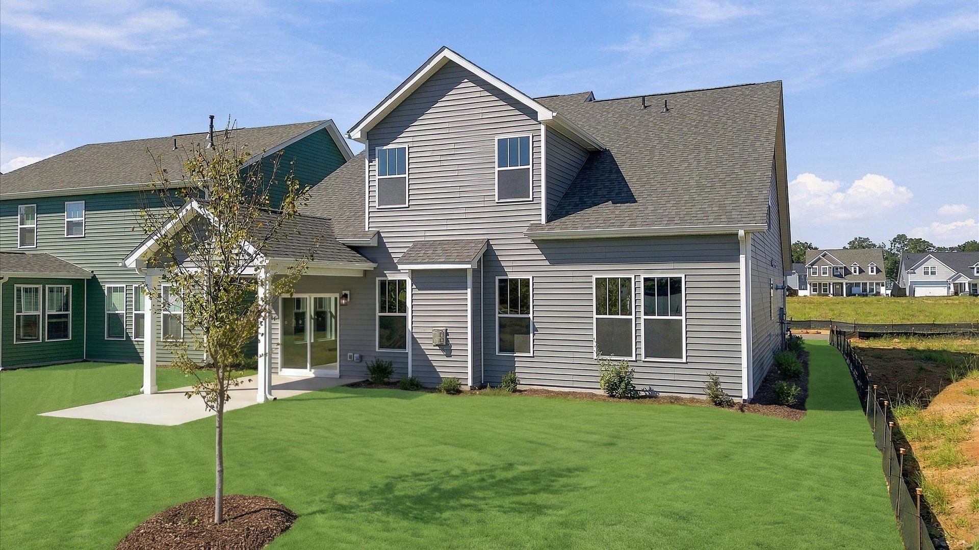 Warm and inviting outdoor living space with a covered rear porch and tasteful finishes near Lake Bowen