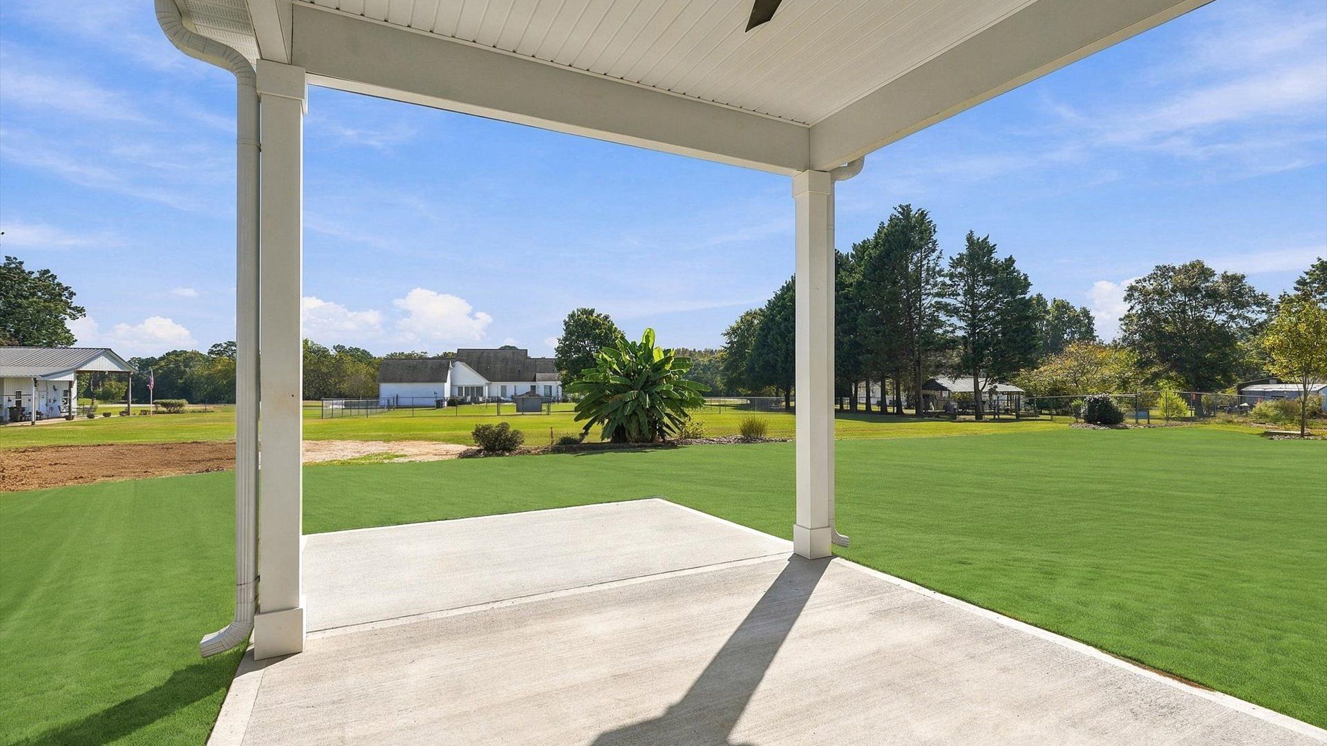Vibrant rear outdoor space featuring a covered porch and exceptional craftsmanship by DRB Homes