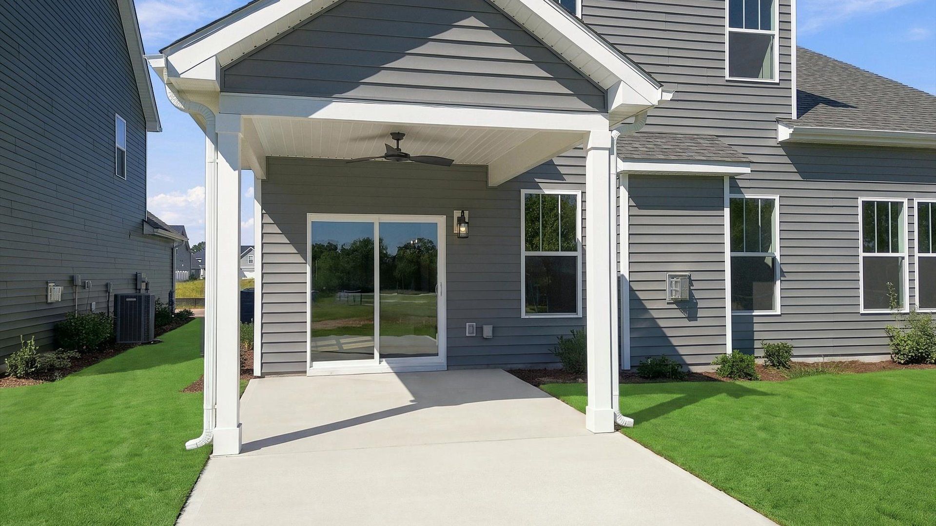 Superior curb appeal continues to the back with a refined, covered outdoor living space at Walnut Ridge