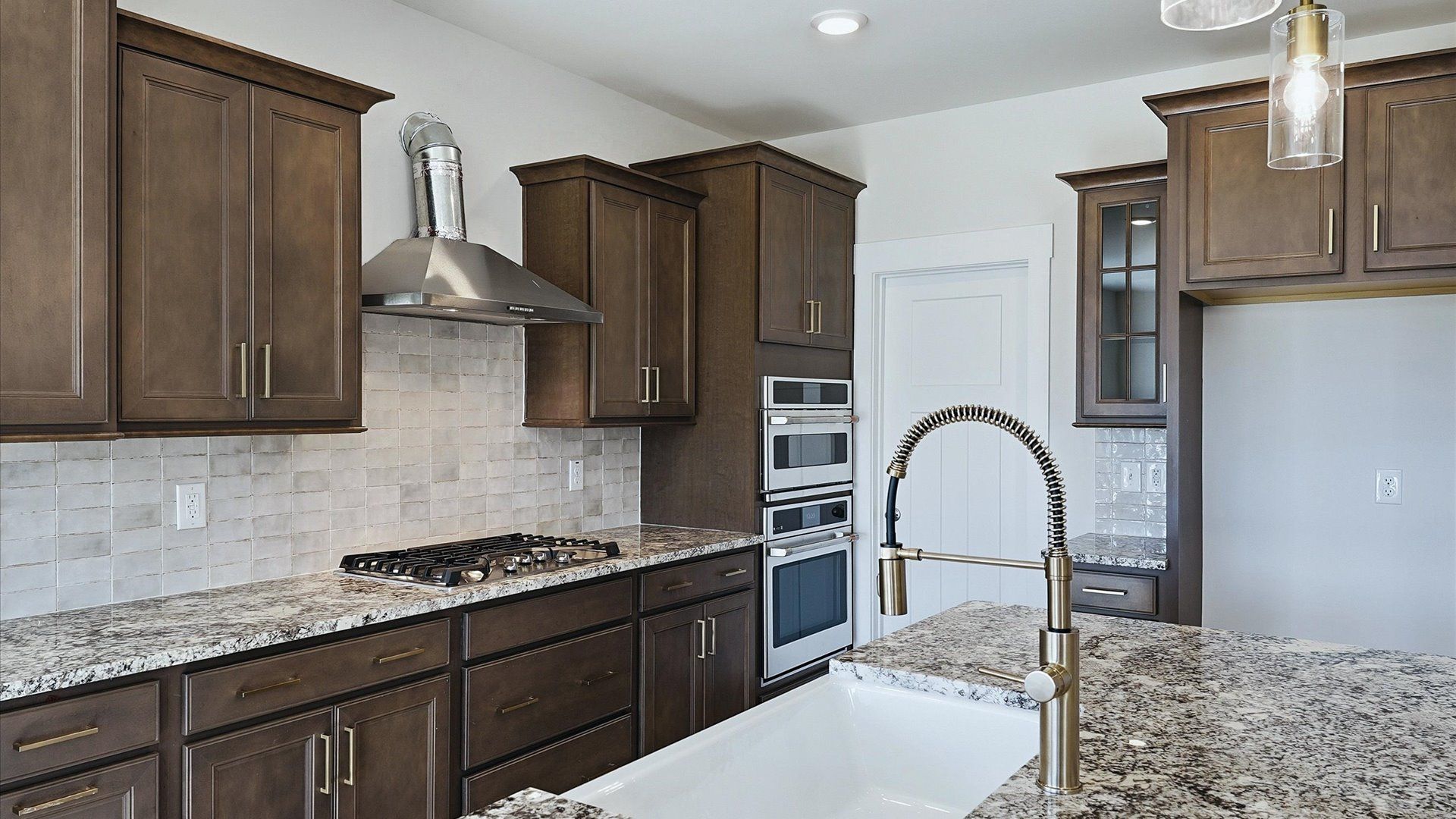 Exclusive kitchen design with large island, pendant lights, and tasteful finishes throughout near Lake Bowen