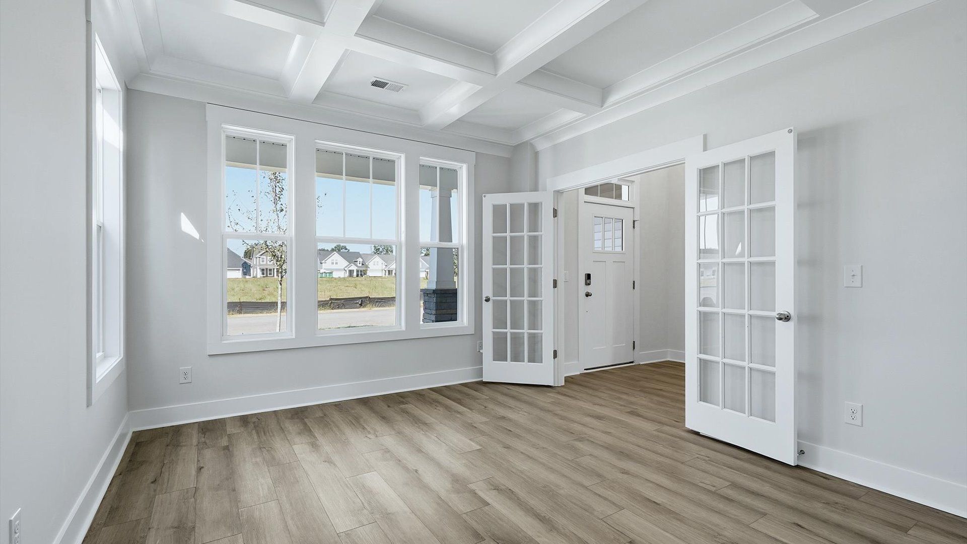 Tasteful French door study offering a quiet, elegant workspace in this vibrant Inman, SC home