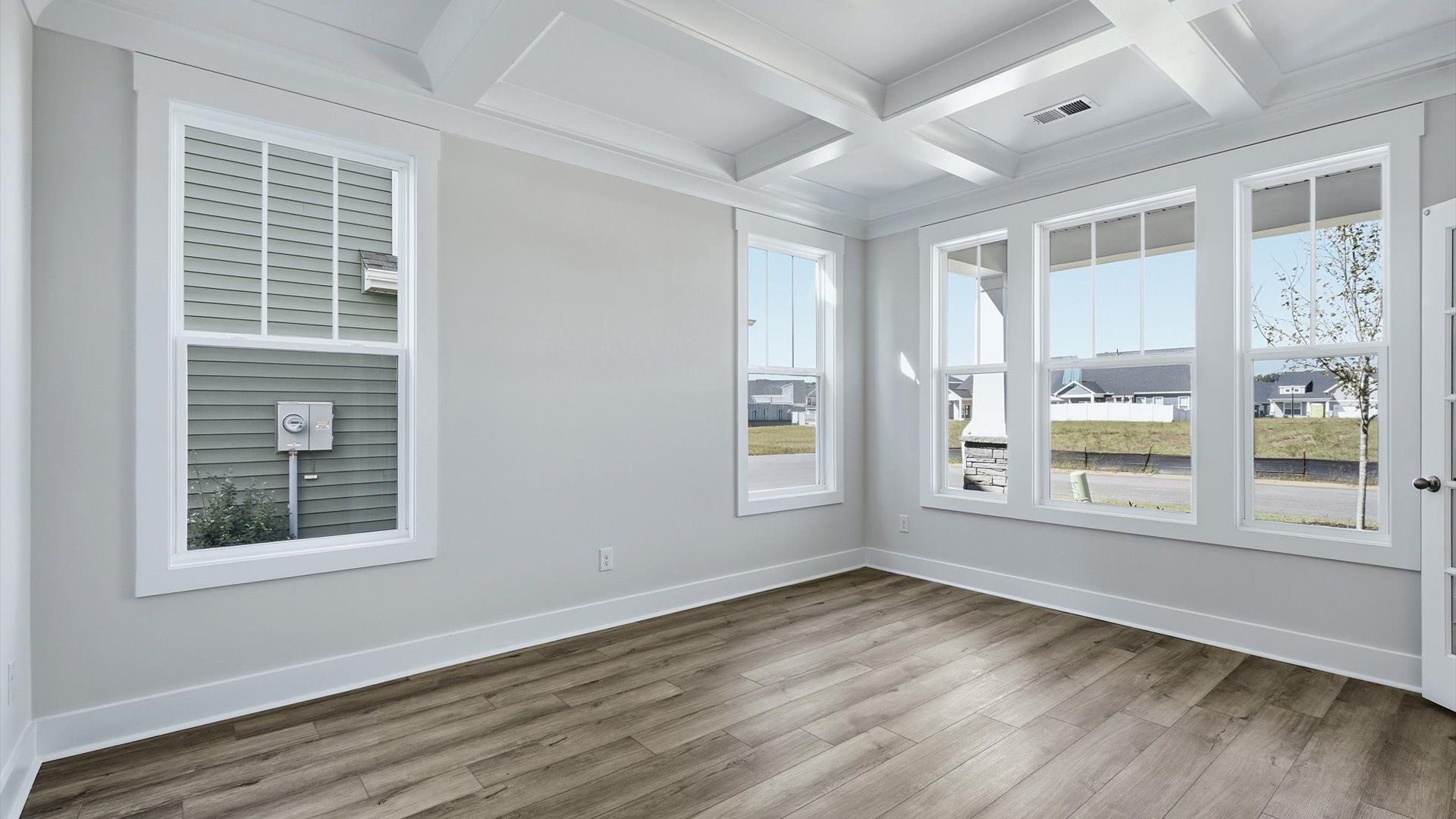 Memorable workspace with French doors, modern finishes, and exceptional light and flow by DRB Homes