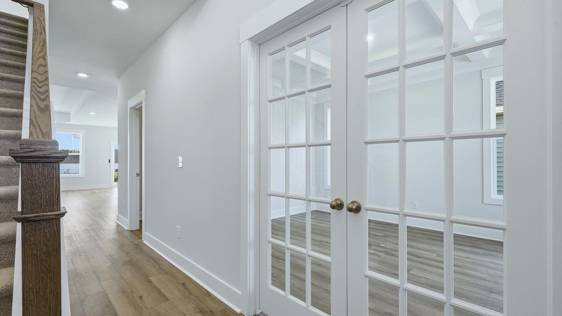 Superior design begins at the front door with a hardwood floor foyer and elegant sightlines at Walnut Ridge