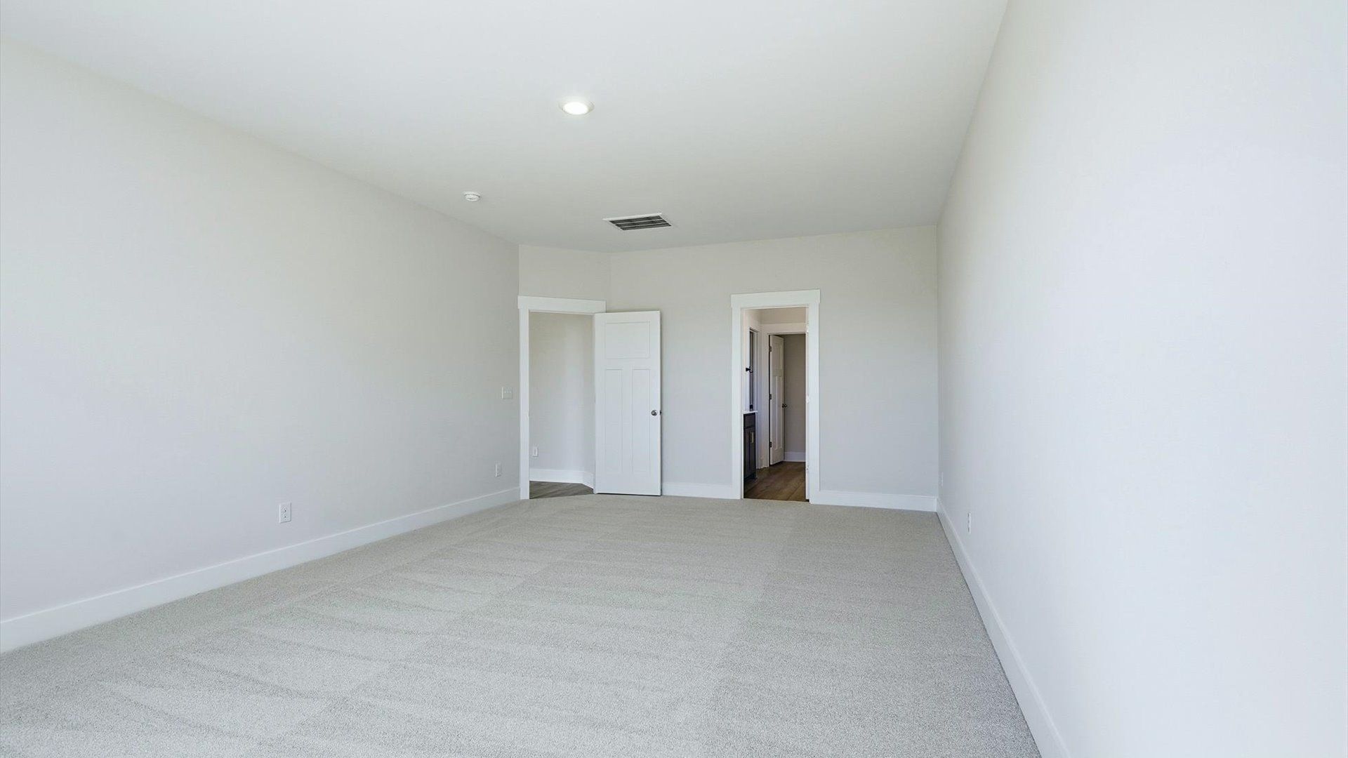 Accomplished primary retreat with eye-catching hardwood flooring in a desirable community near Lake Bowen