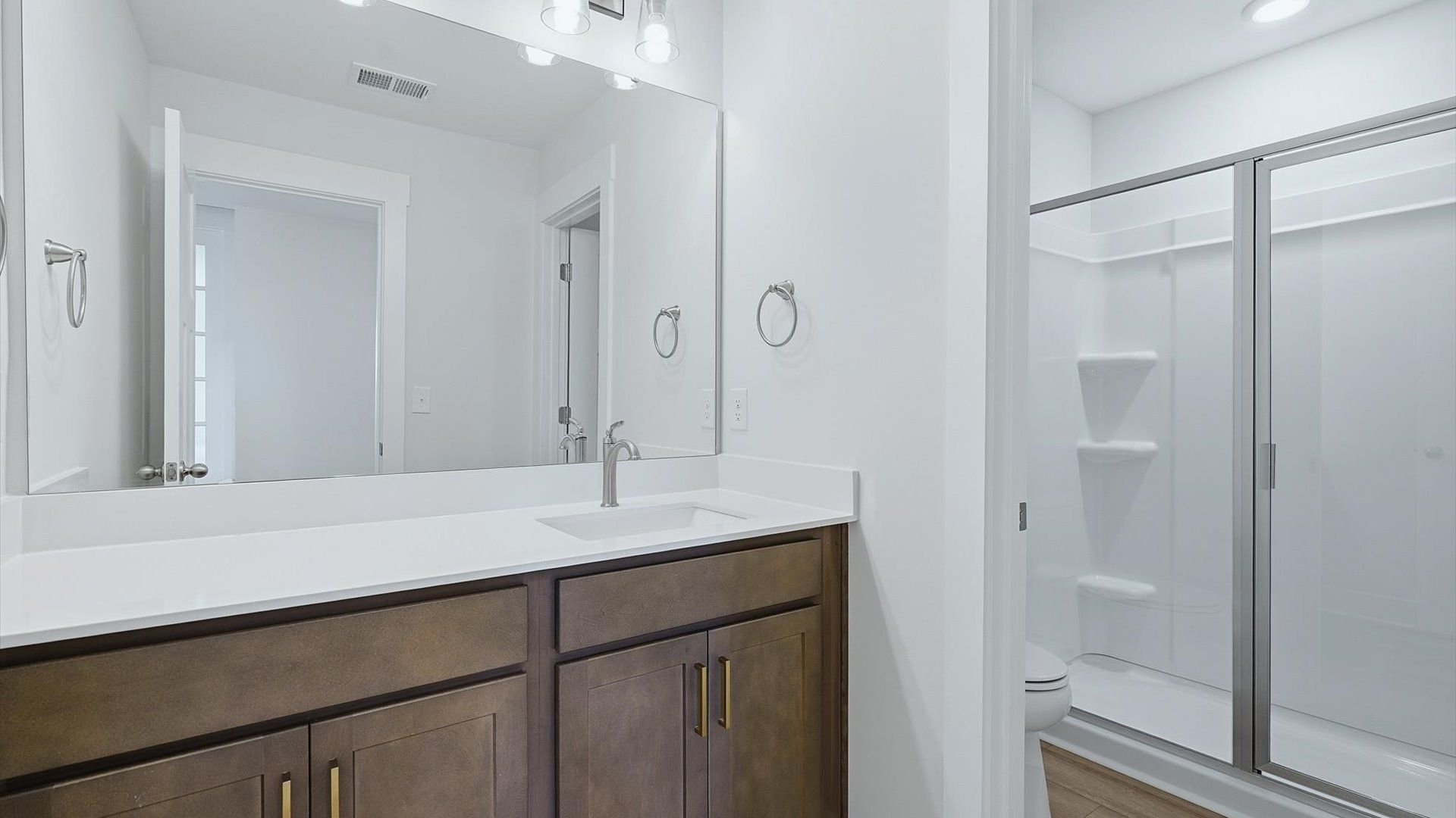 Top-notch bathroom with current fixtures, tasteful materials, and elevated charm near Lake Bowen