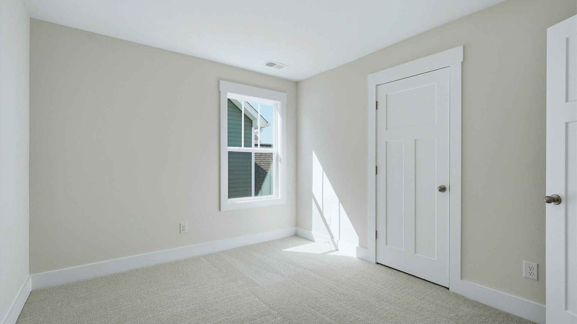Superior comfort in a secondary bedroom with plush carpet and an oversized walk-in closet by DRB Homes