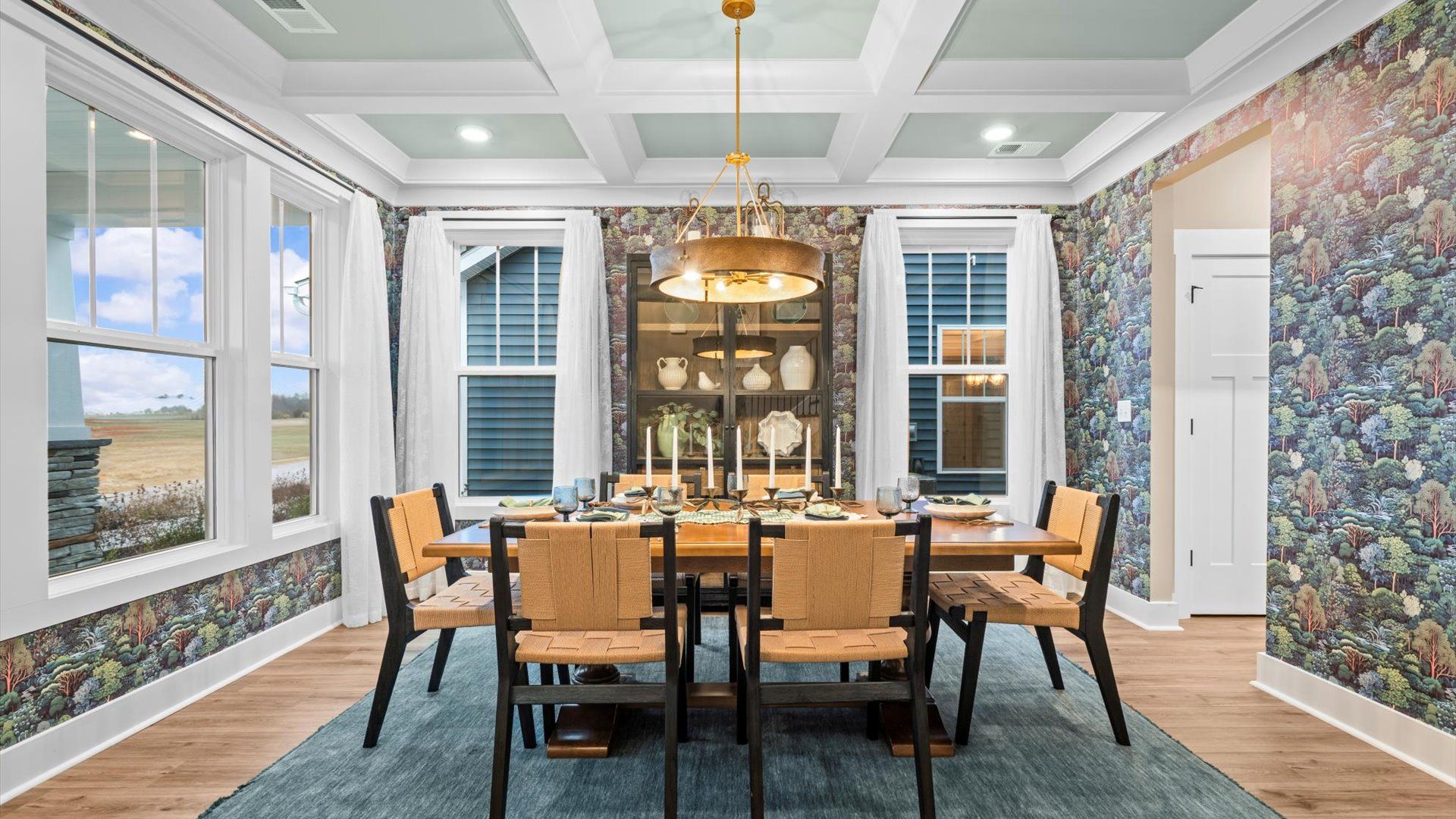 Eye-catching coffered ceiling adds charm to the formal dining space in this superior DRB Homes design