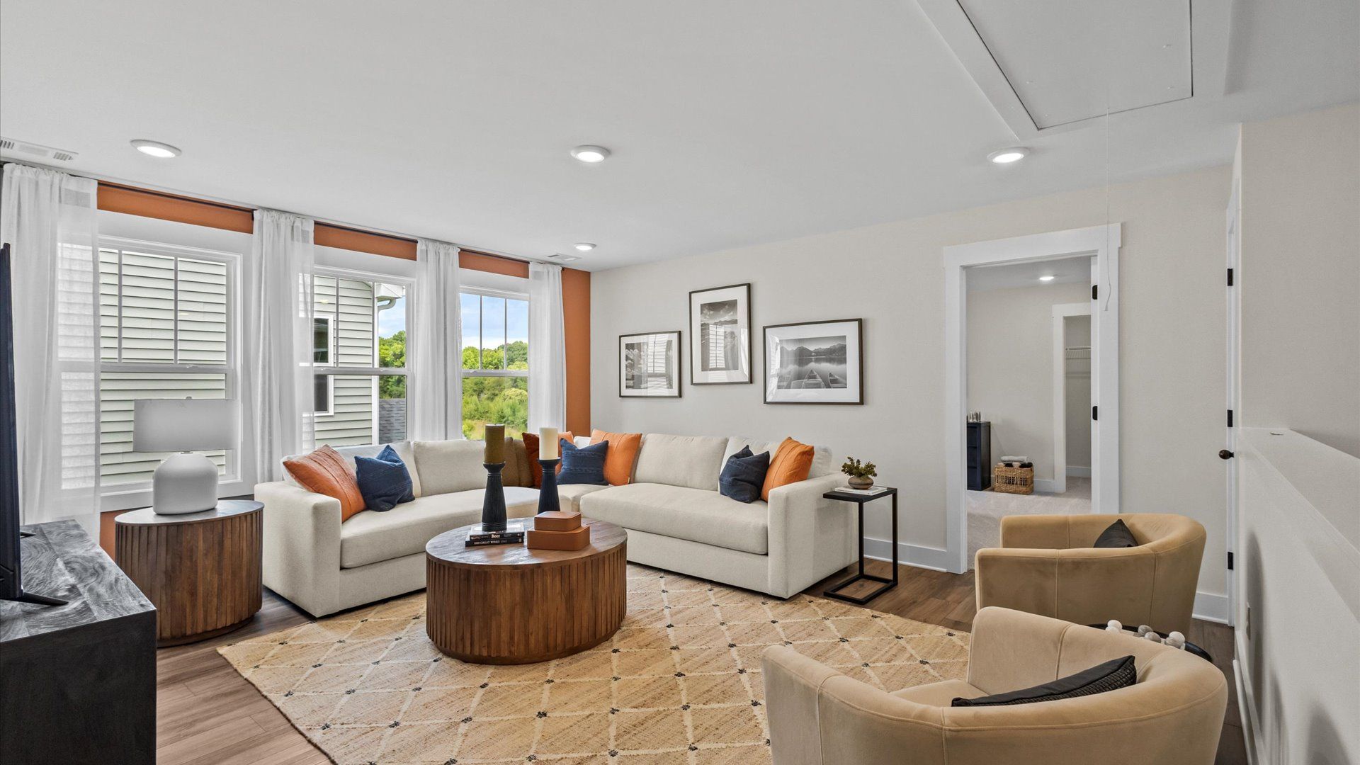 Vibrant upstairs loft offering flexibility as a study nook, game room, or second family space at Alexander Place
