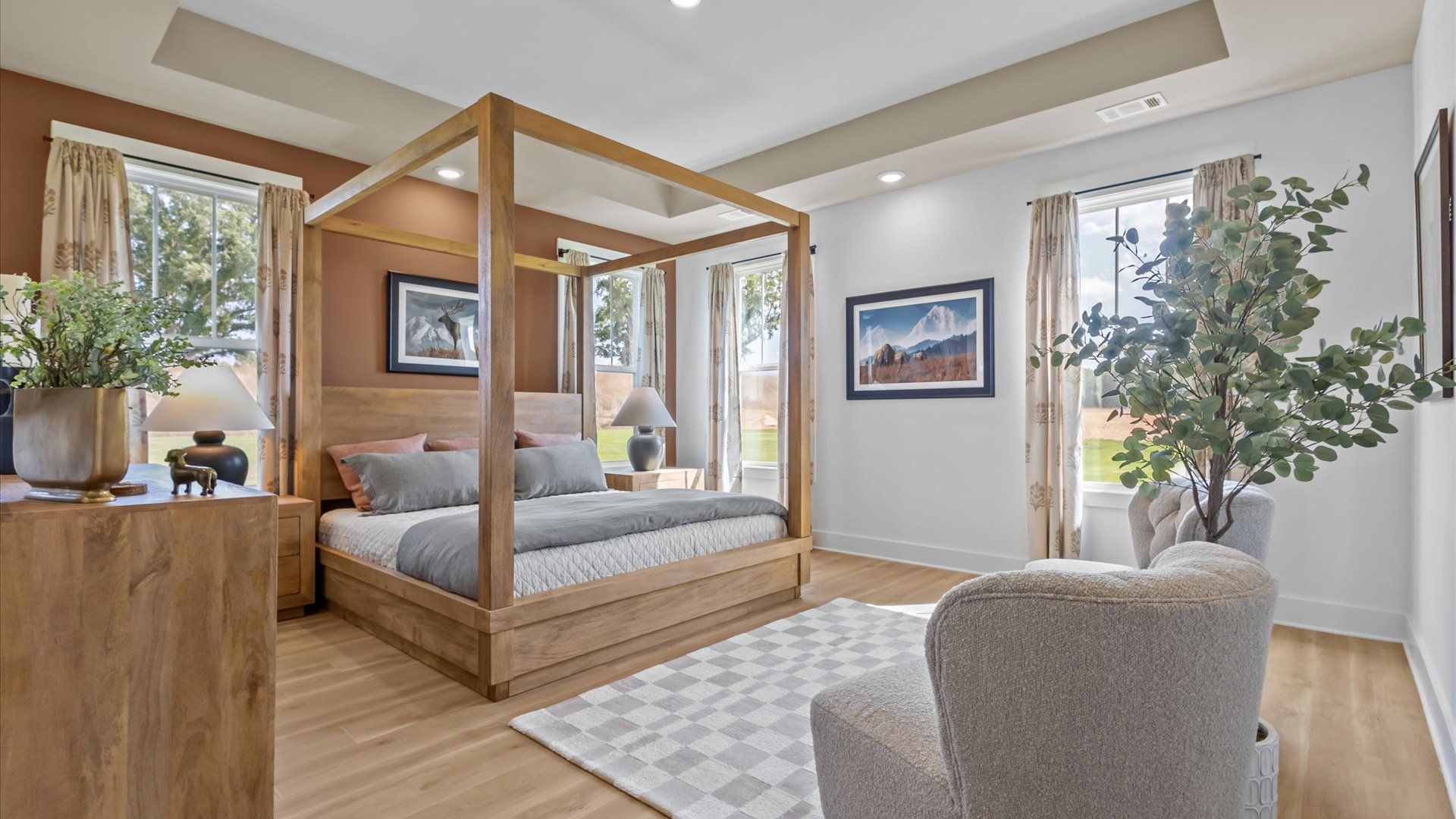 Eye-catching details and elegant finishes in the vibrant primary suite of this select home at Woodland Summit