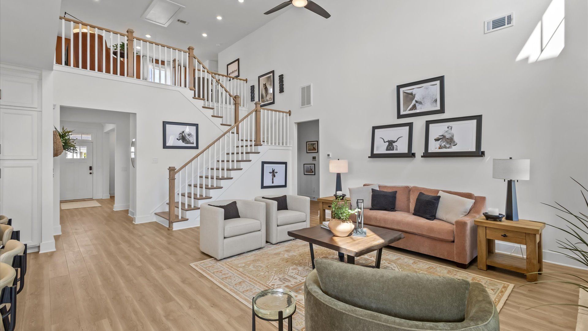 Hardwood flooring and high standards define this vibrant family room ideal for everyday living in Greenville, SC