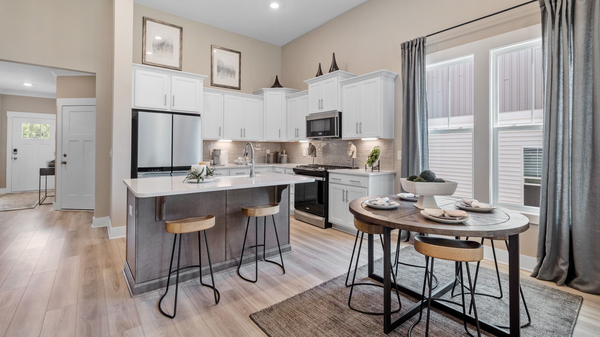 Spacious kitchen with large island with room for counter stools and breakfast area at Aspen Ridge by DRB Homes in Lyman, SC