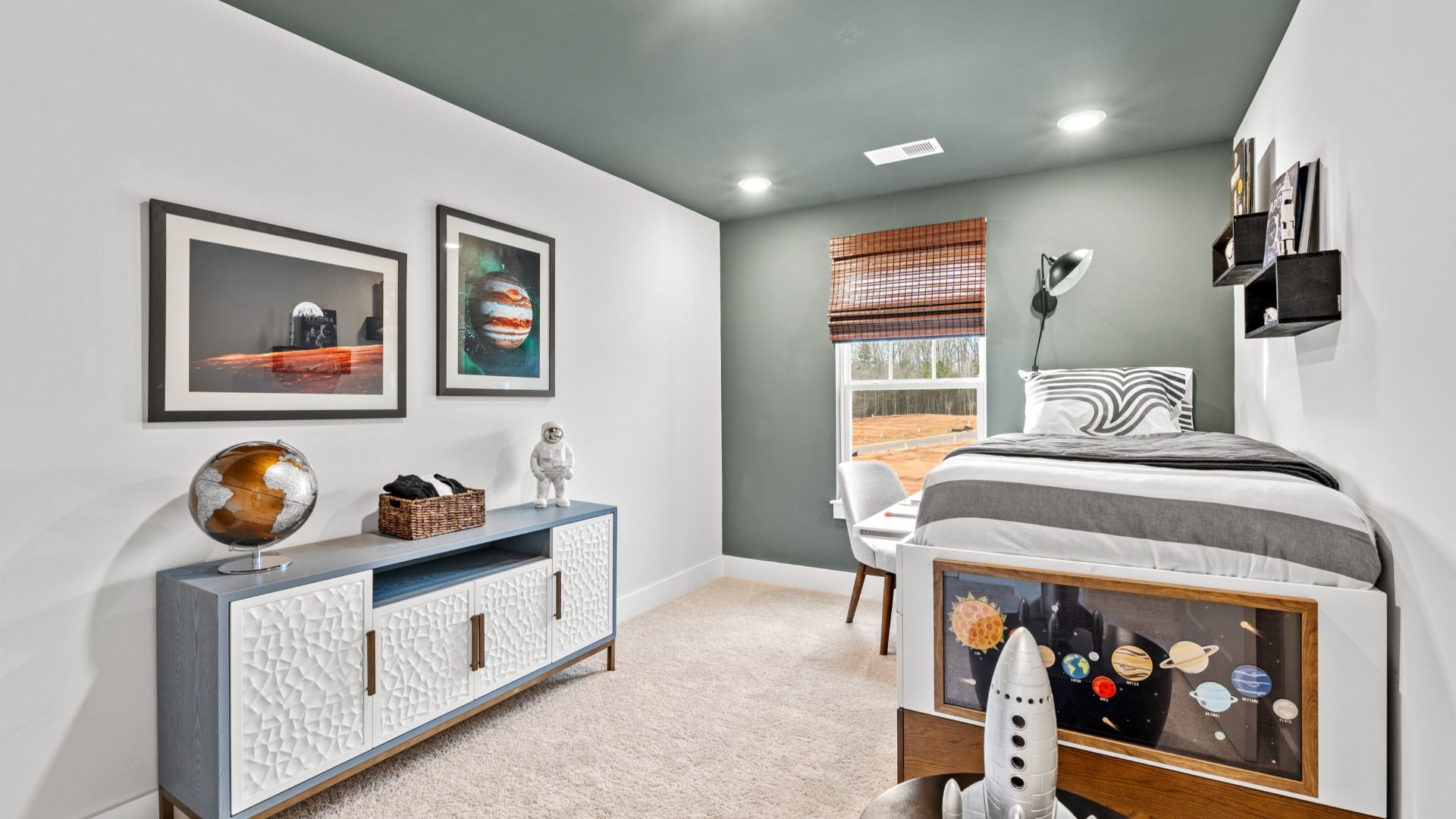 Elevated secondary bedroom with accent wall and ceiling, carpeted flooring, and large window at Aspen Ridge in Lyman, SC