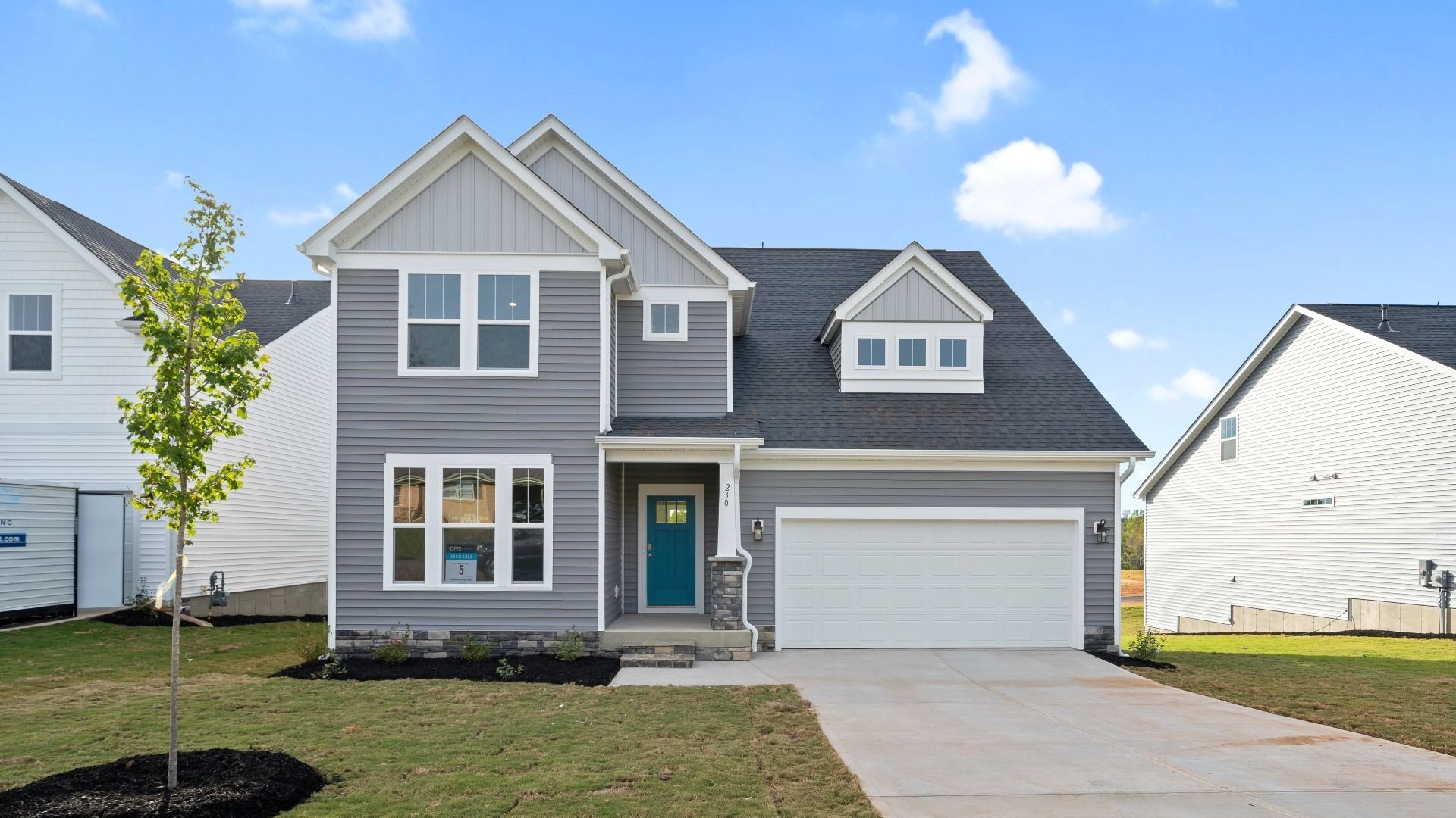 DRB Homes' Woodglen in Piedmont, SC offering the Drayton floorplan, shown here with gray exterior siding