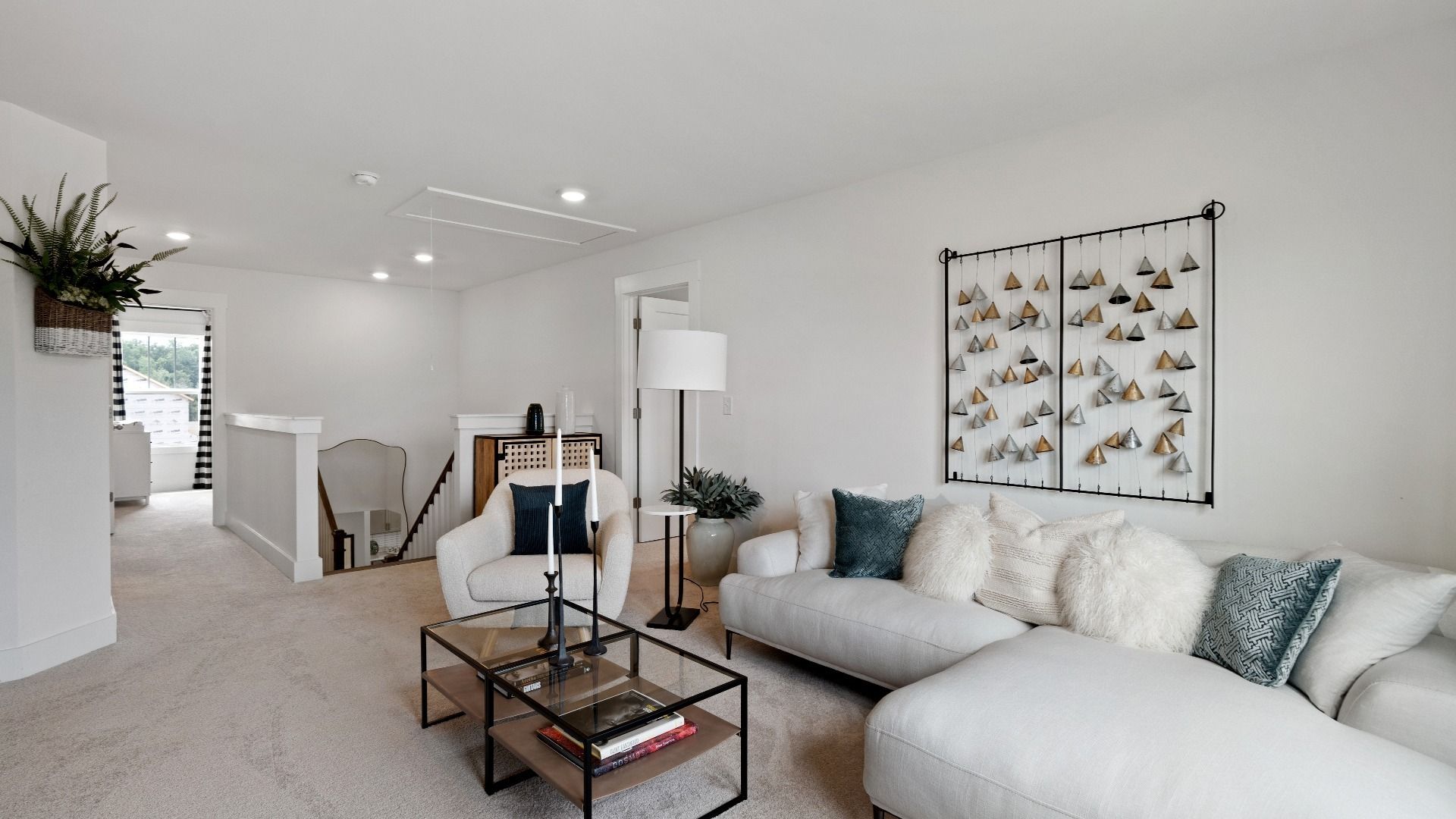 Cozy, plush carpeted bonus room with large windows at Walnut Ridge by DRB Homes in Inman, SC