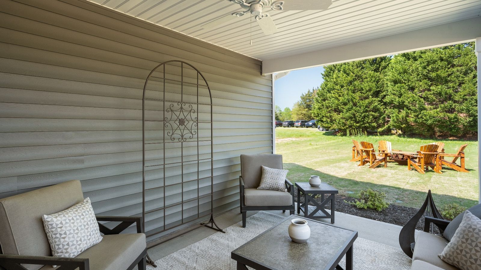 DRB Homes' Wells Crossing new home with covered rear porch with ceiling fan at Wells Crossing by DRB Homes