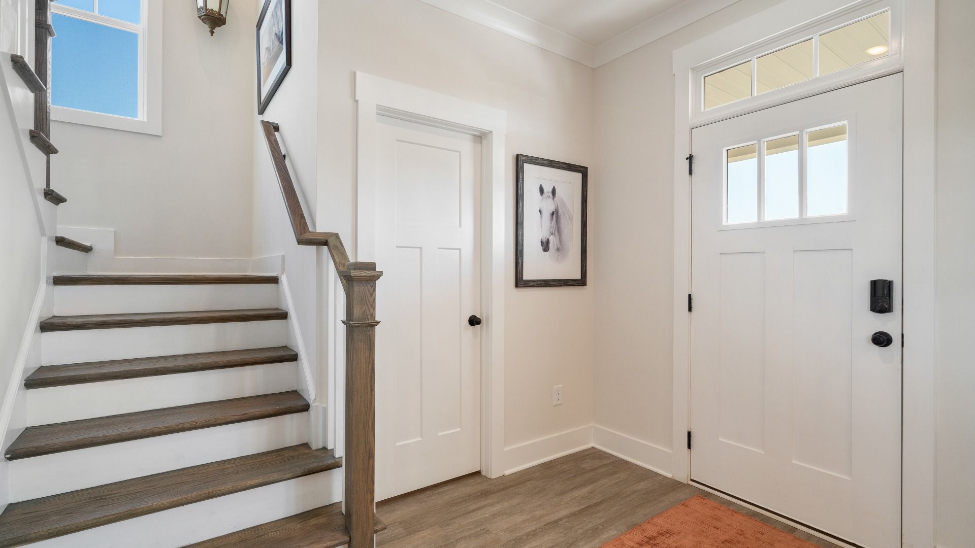 Superior design begins at the front door with a hardwood floor foyer and elegant sightlines at this home in Woodruff, SC