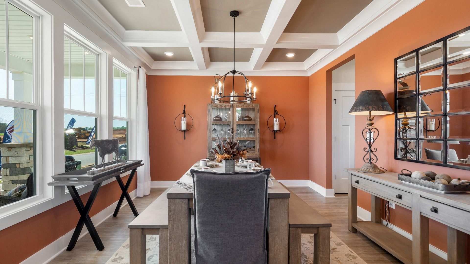 Tasteful coffered ceiling highlights the high standards of this vibrant DRB Homes dining room at Pinebrook