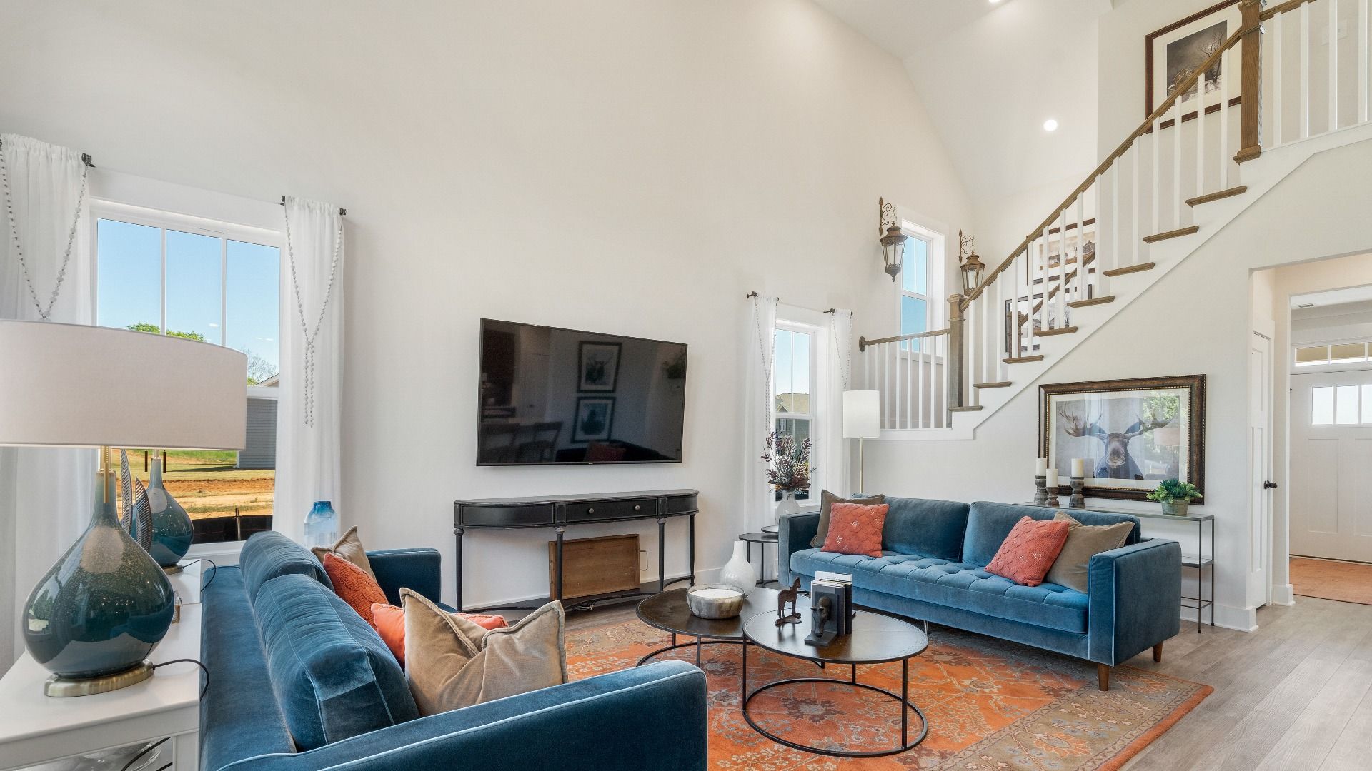 Seamless indoor flow highlights this thoughtfully crafted family room in the Sutherland Design at Wells Crossing