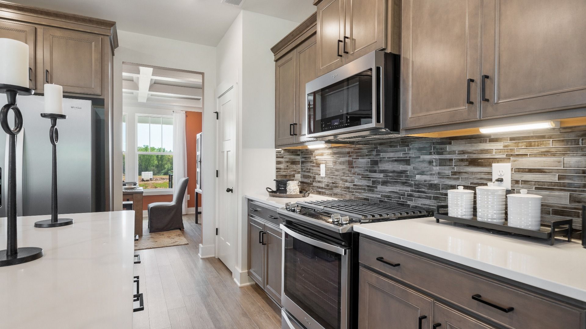 The Sutherland Design kitchen offers a balance of sophistication and functionality for daily use at Pinebrook