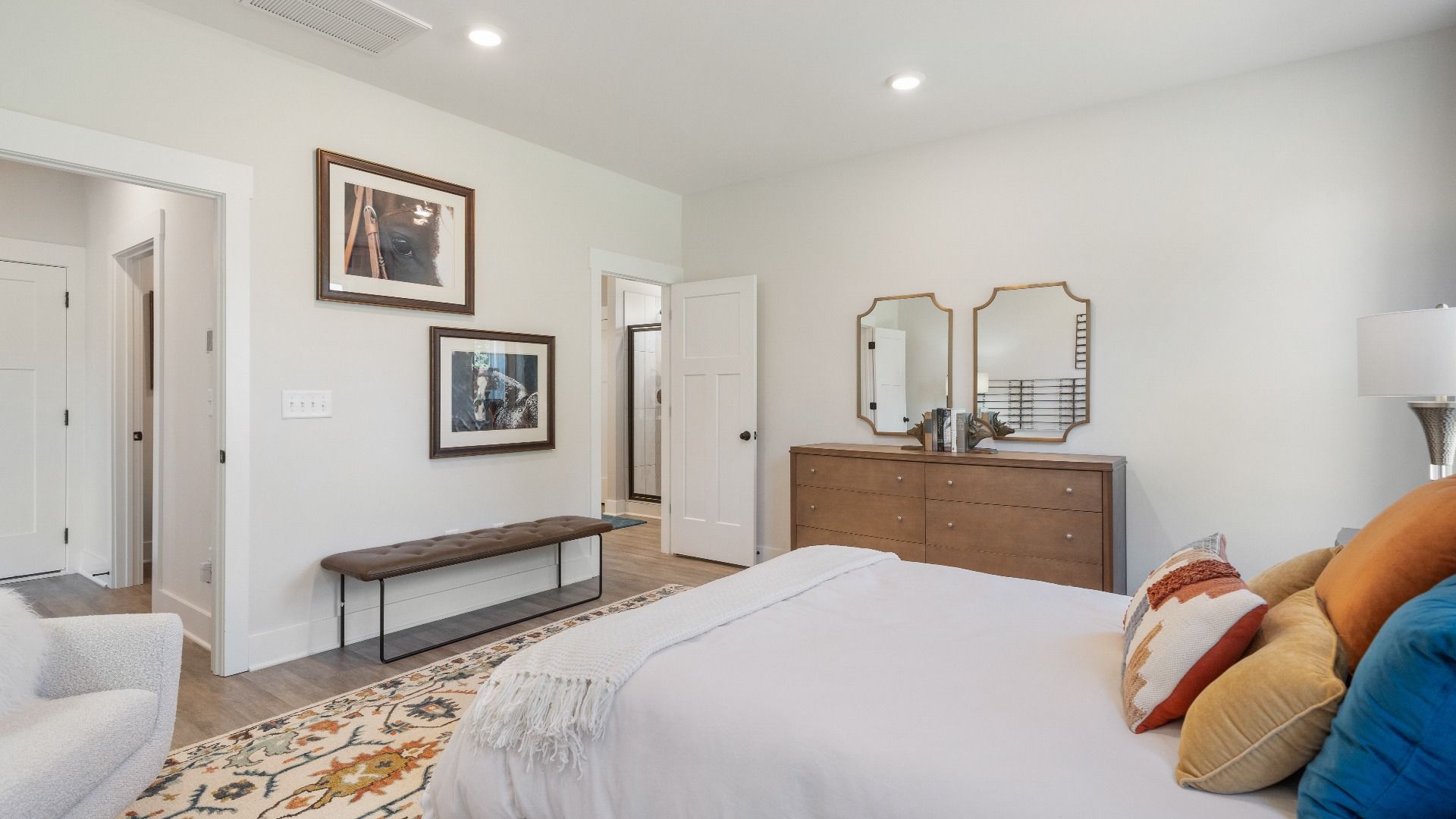 The Sutherland Design highlights a primary suite with a spacious layout and relaxing atmosphere