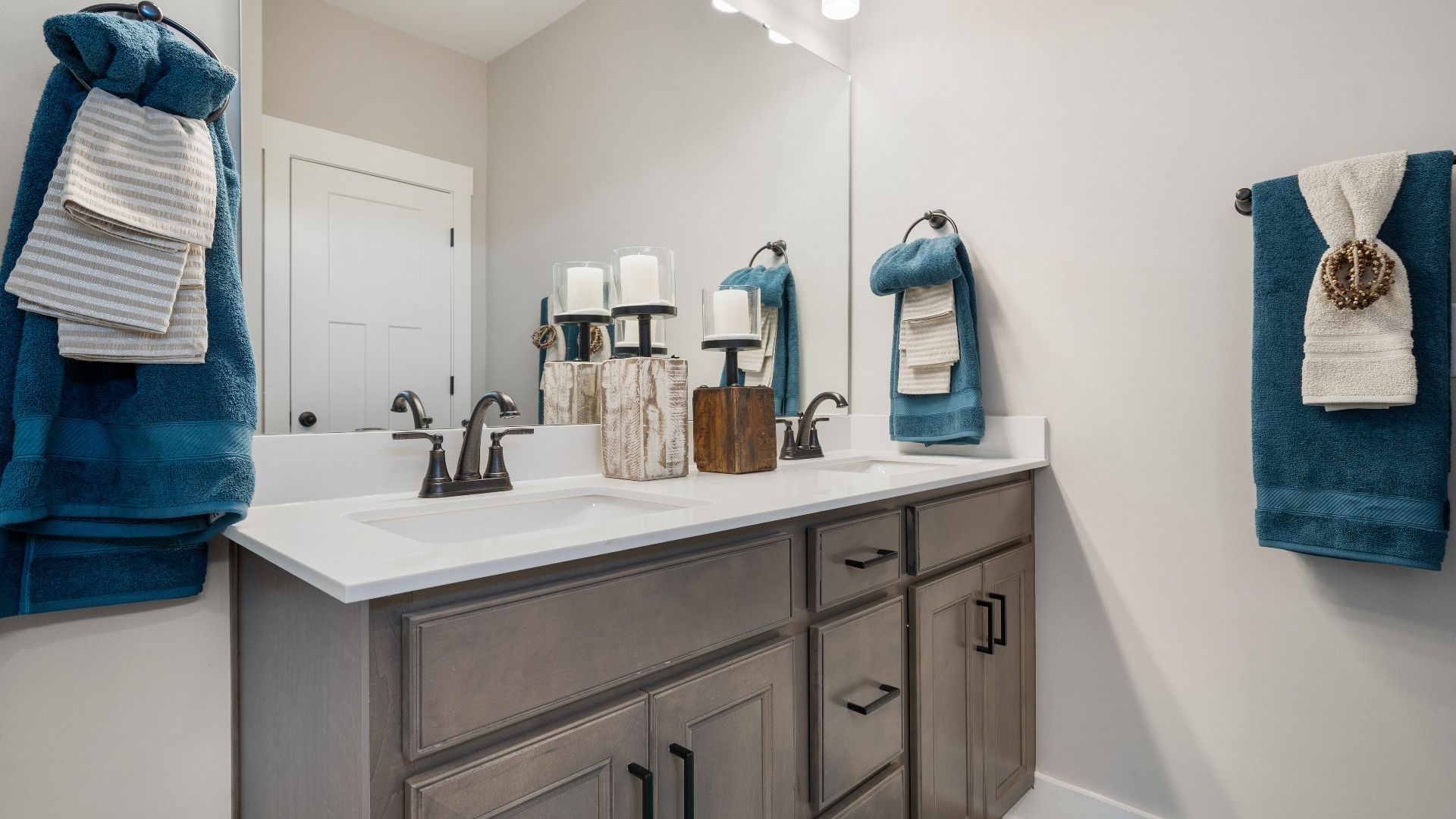 Notable primary suite with dual vanities and walk-in shower in this prime Wells Crossing single-family home