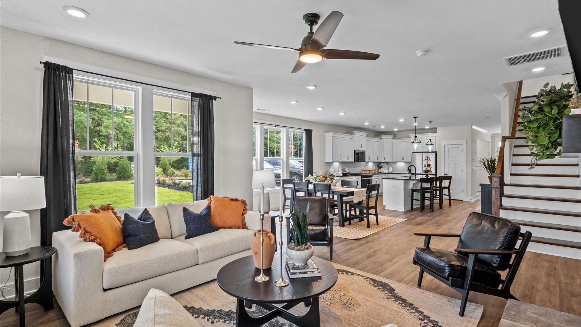 Spacious family room with accomplished design and eye-catching details throughout