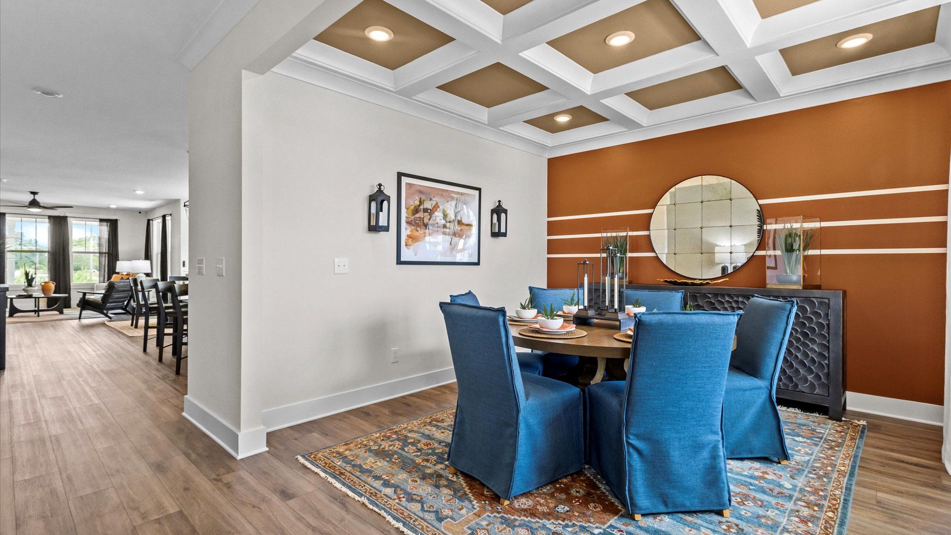 Notable coffered ceiling elevates this accomplished dining room