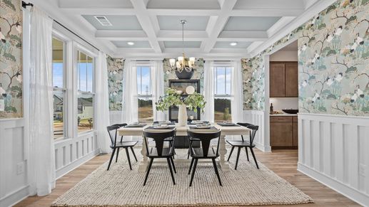 Memorable meals start beneath a coffered ceiling in this elegant and functional space