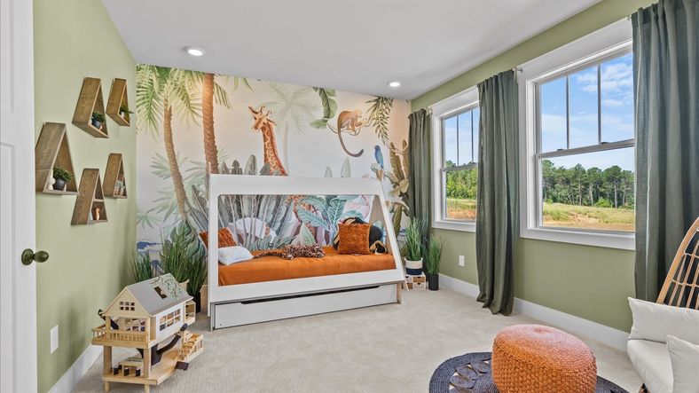 Superior comfort in this light-filled bedroom with plush carpeting and thoughtfully placed large windows