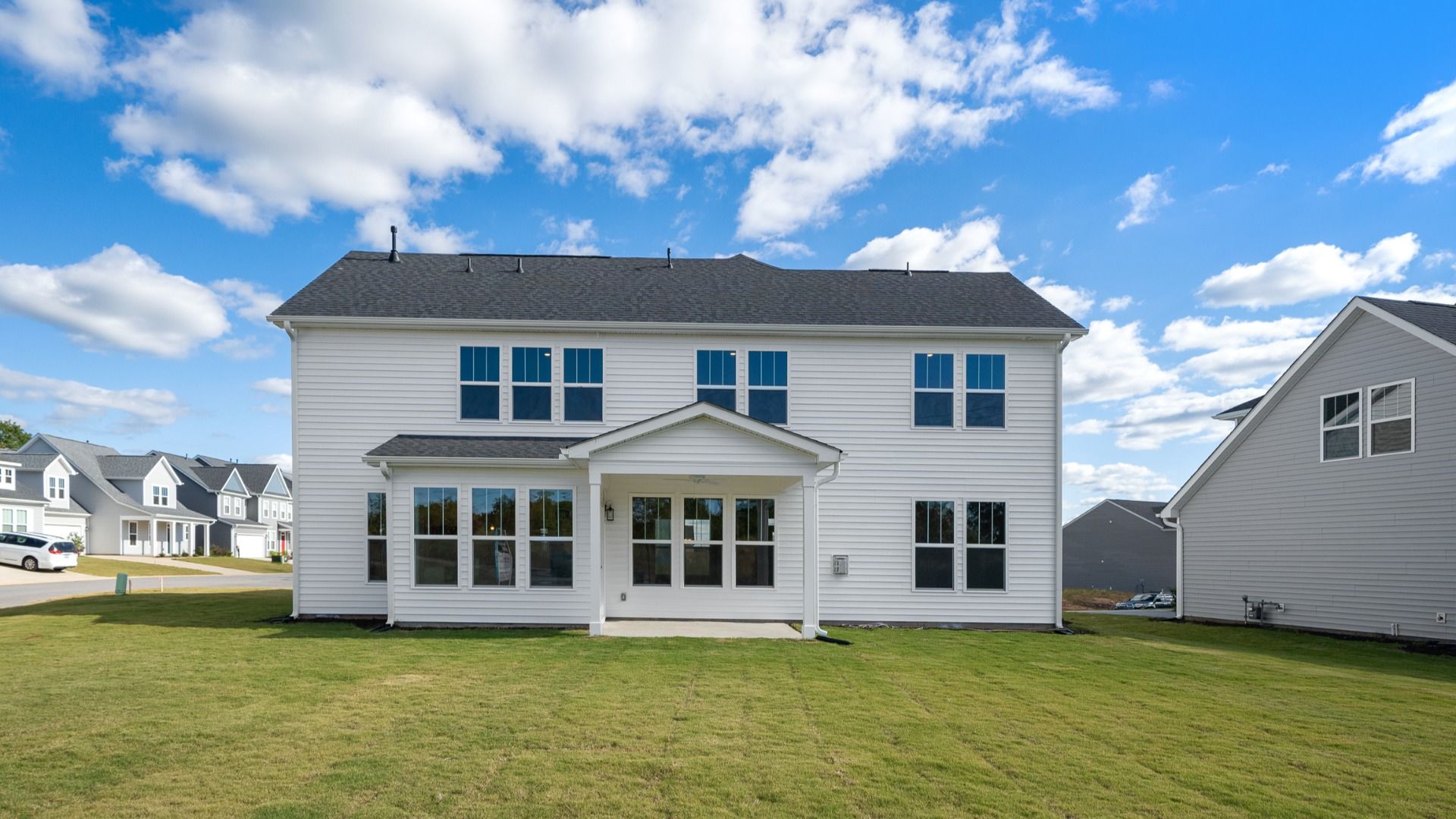 2 story single family home, all white with a 2 car garage