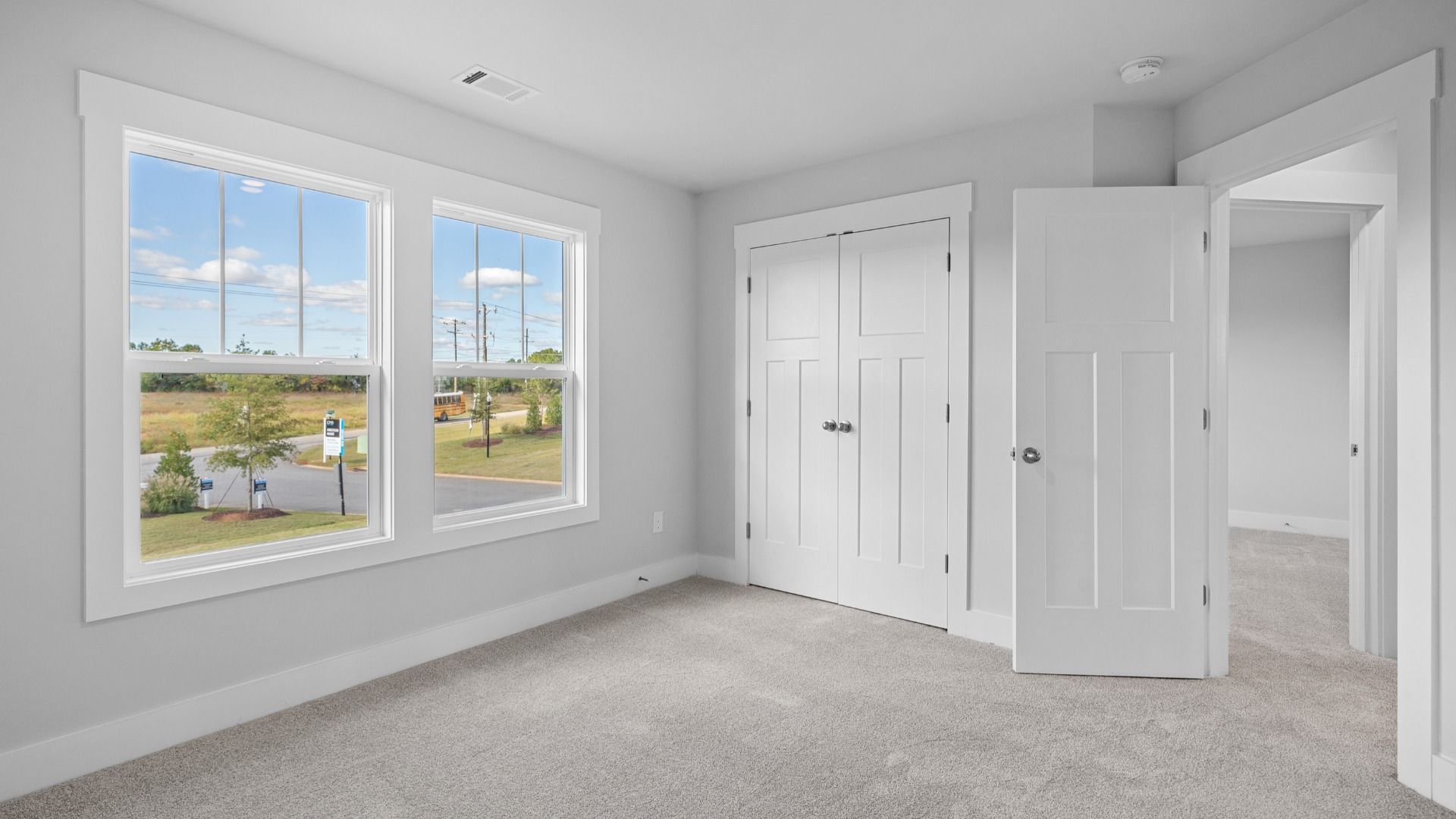 2 story single family home, all white, bedroom