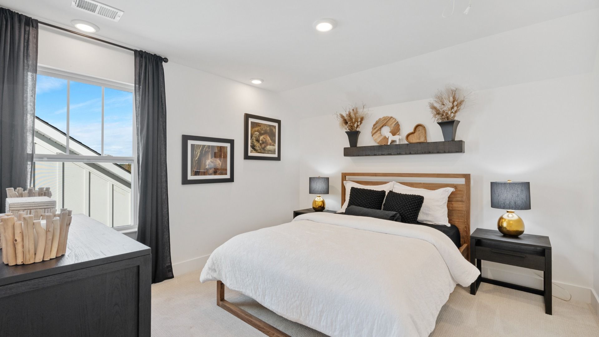 Modern secondary bedroom with elevated ceilings and cozy carpet at Pleasant Falls by DRB Homes in Moore, SC