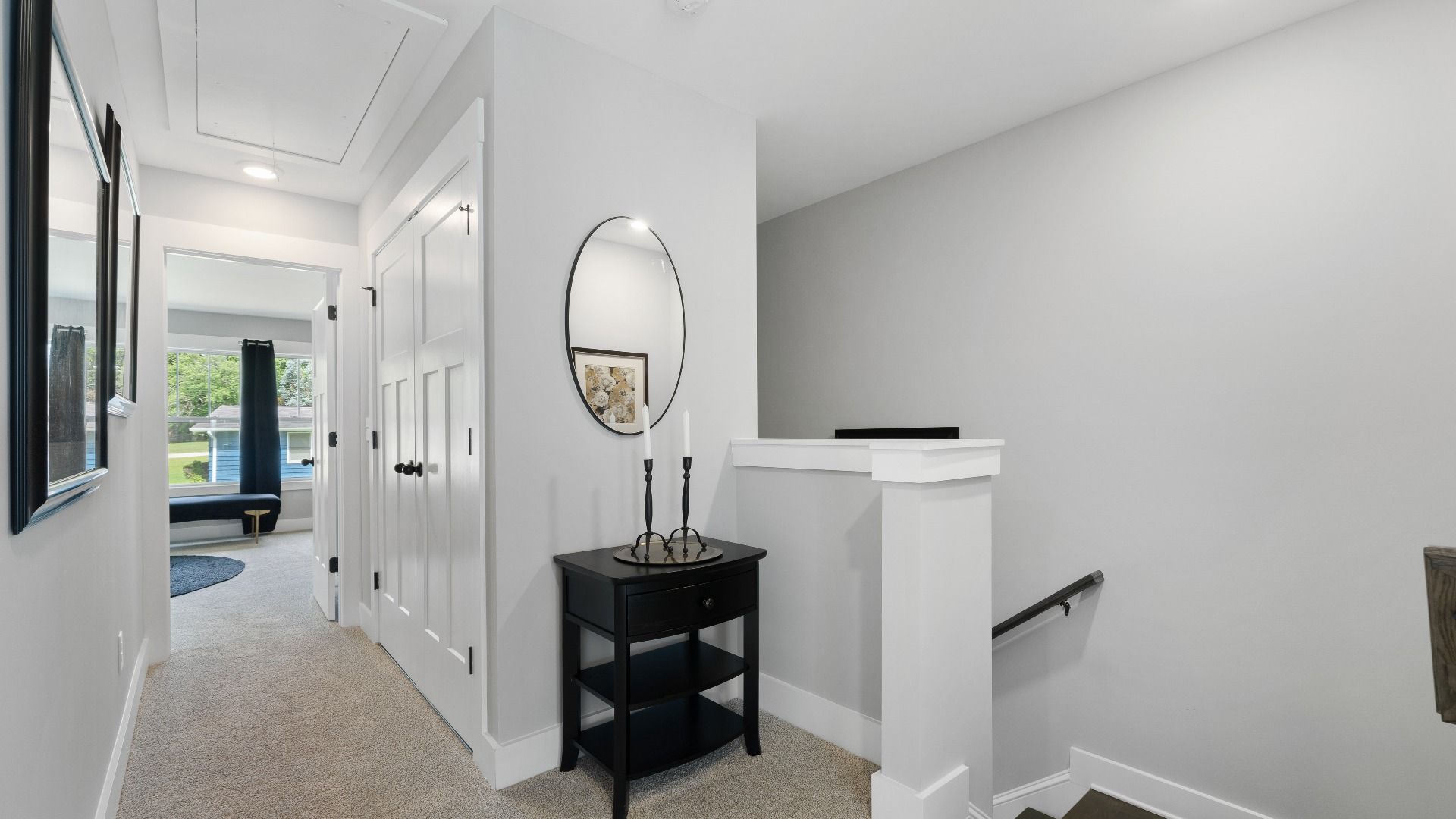 Carpeted hallway with elevated ceilings in two story townhome at Tyger Ridge by DRB Homes in Spartanburg, SC