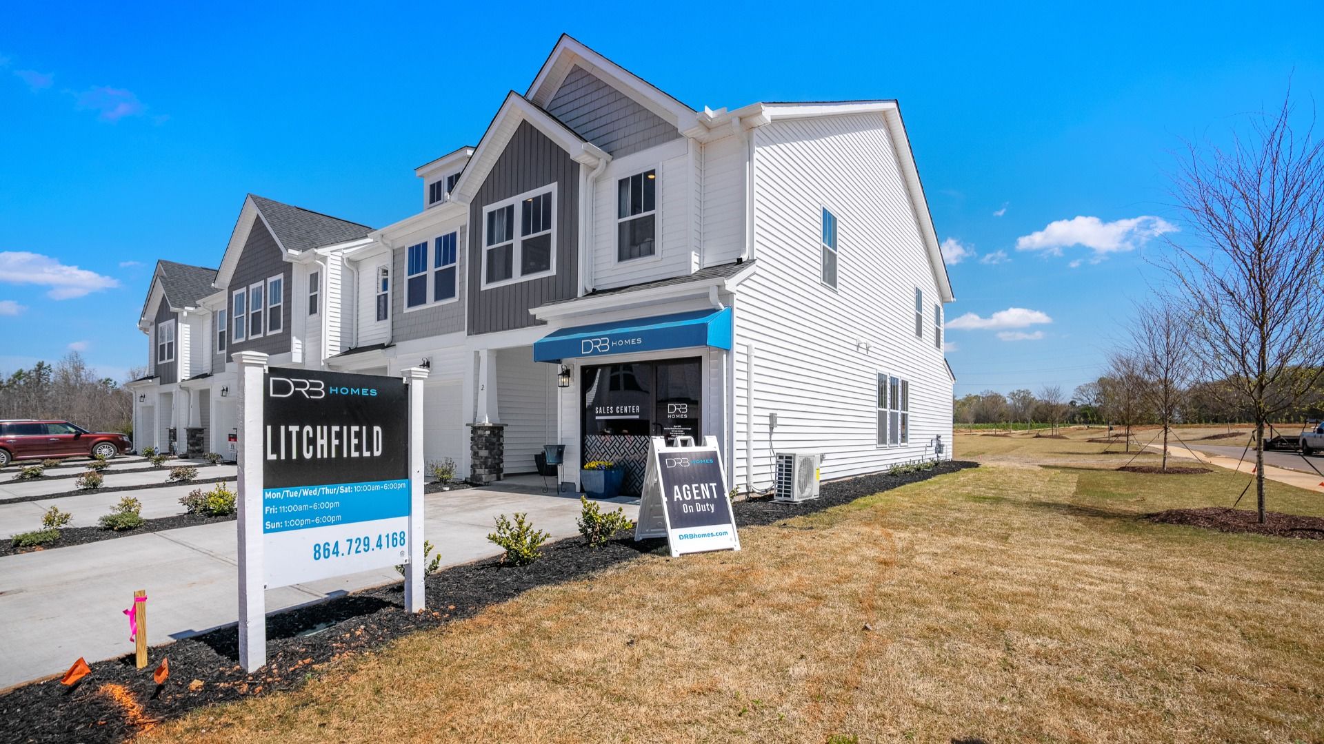 Model Home at Hickory Heights by DRB Homes with white and gray exterior near Downtown Greenville, SC