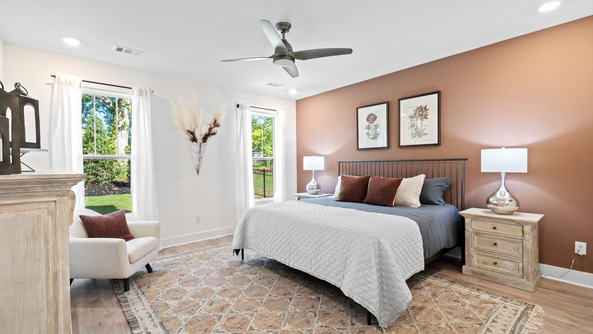 Vibrant natural light fills this exceptional primary suite with eye-catching details