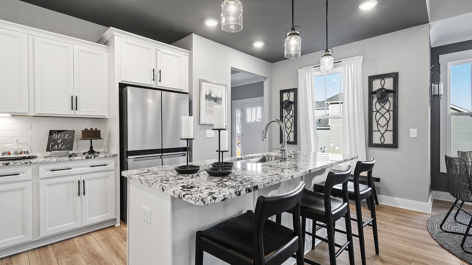 Lakehurst kitchen with dark ceiling, modern accents, crown molding, modern decor and granite countertops at Village at Midway