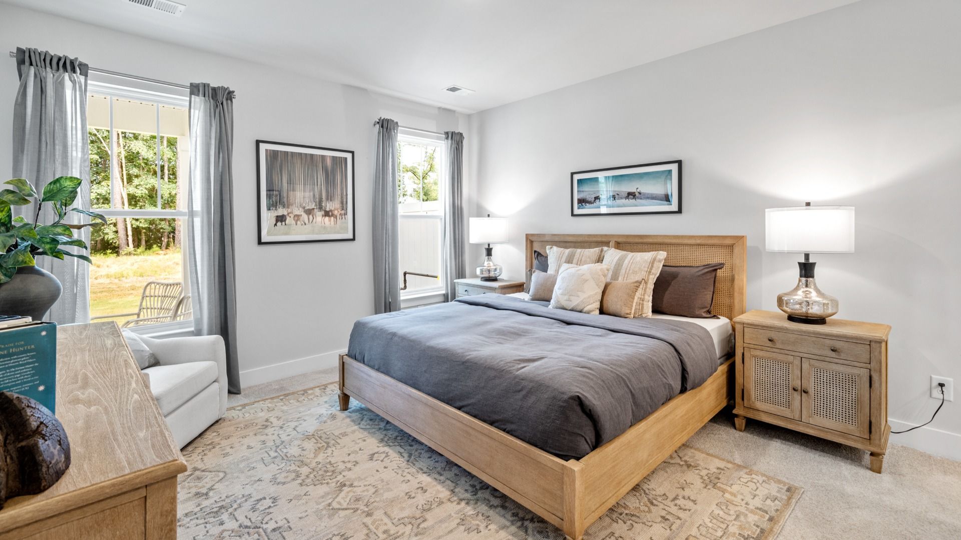 Primary bedroom with en suite bathroom, elevated ceilings, and hardwood flooring at Aspen Ridge by DRB Homes in Lyman, SC