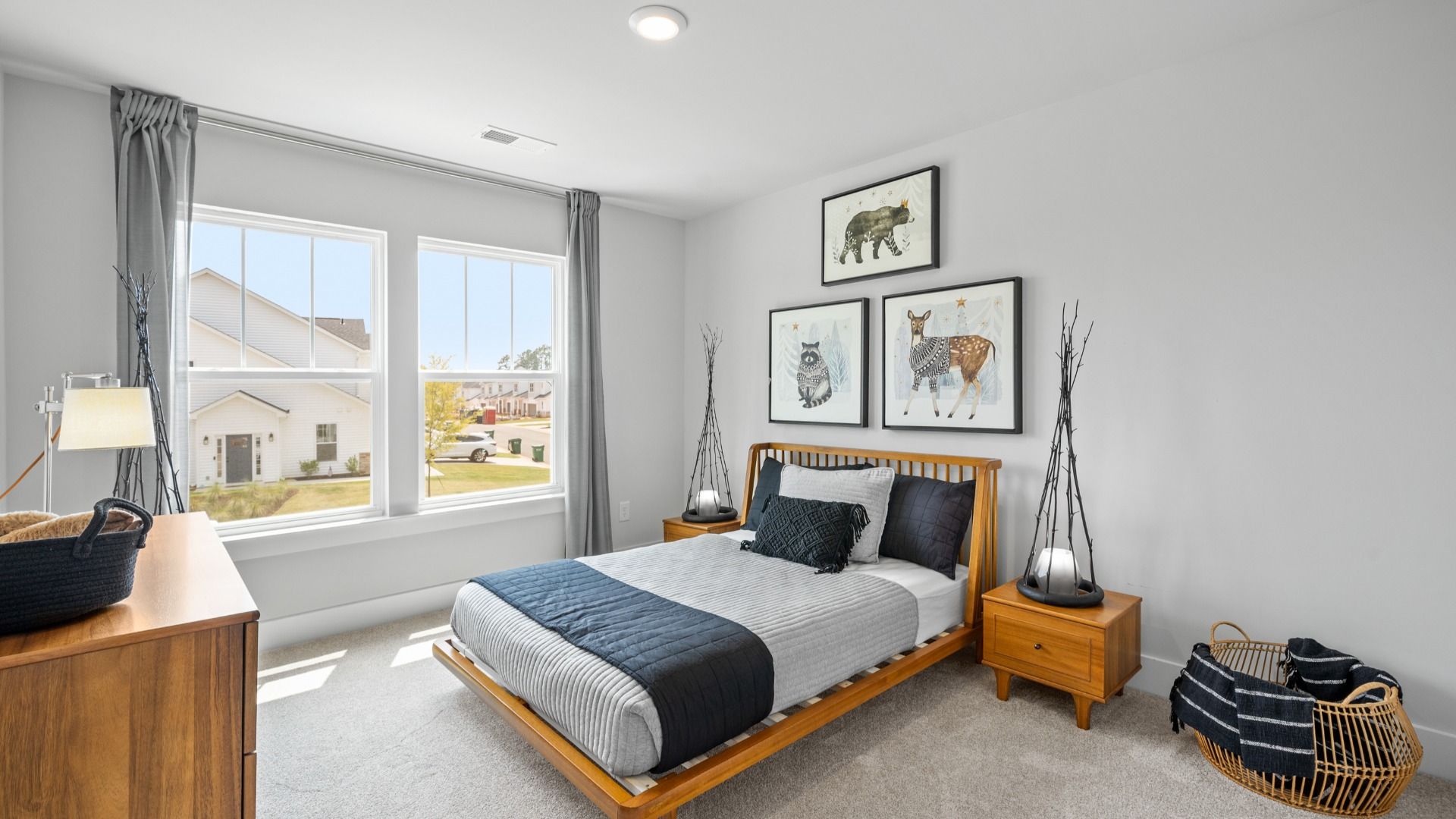 Large secondary bedroom with carpet and large windows at Aspen Ridge by DRB Homes in Lyman, SC