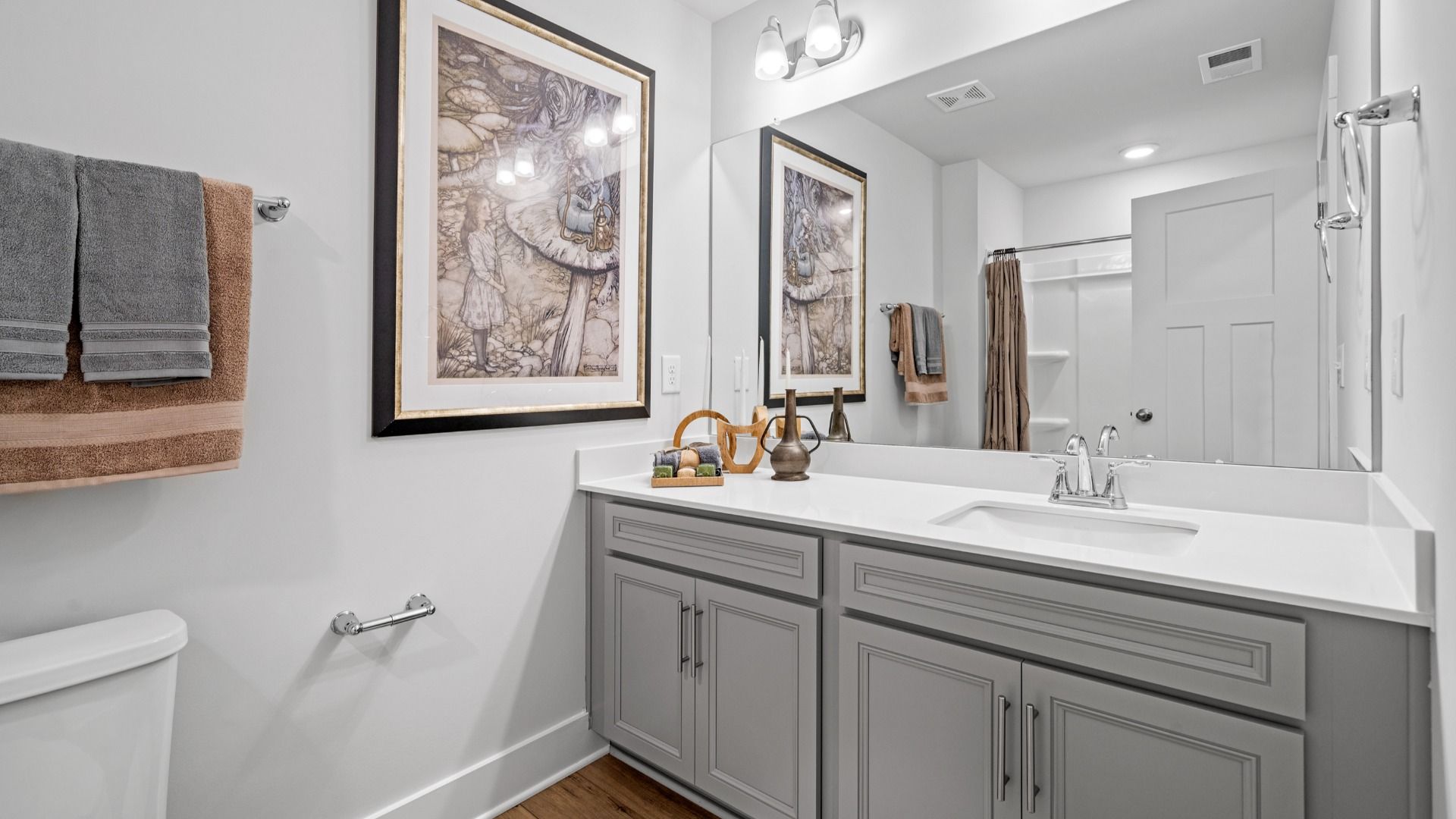 Elevated secondary bathroom with large vanity, gray cabinetry, and polished nickel finishes at Aspen Ridge