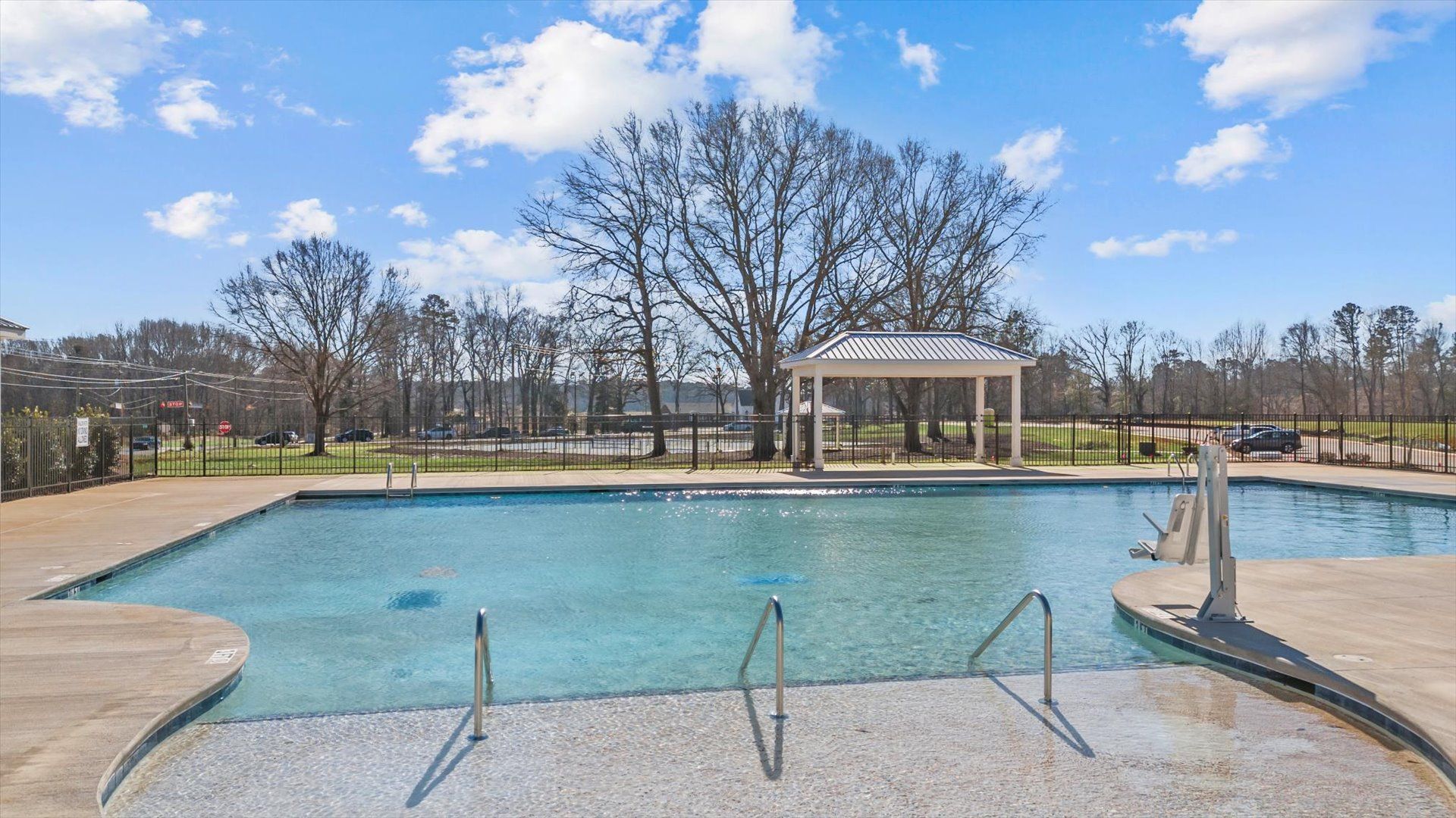 Pool with nature surroundings at the Village at Midway amenity center in Anderson, SC with pool and cabana