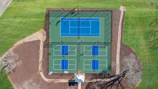 Dual tennis and pickleball courts at the Village at Midway amenities center by DRB Homes in Anderson, SC
