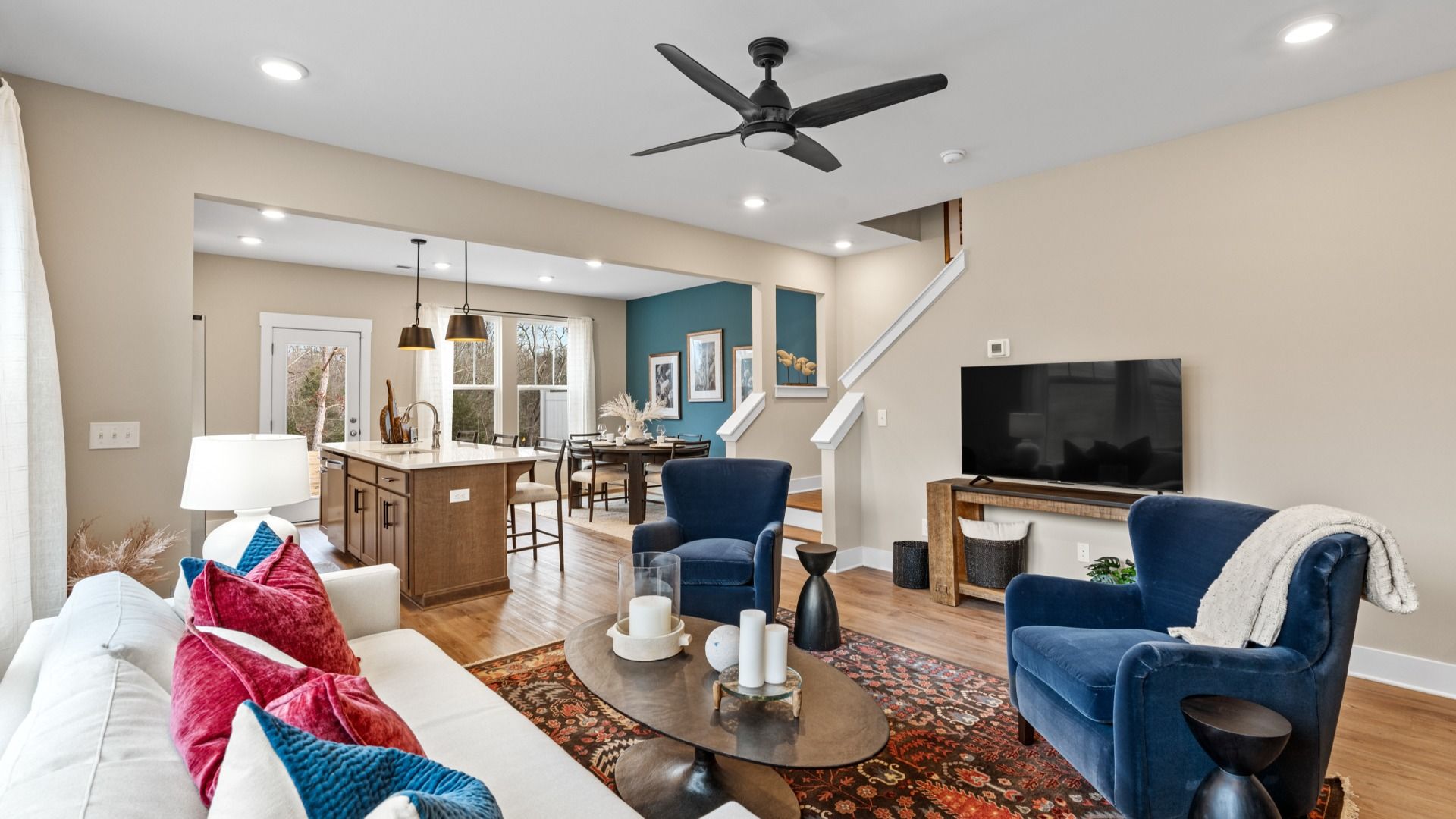 Cozy, inviting family room with hardwood flooring in two story townhome at Saluda Crossing by DRB Homes in Piedmont, SC