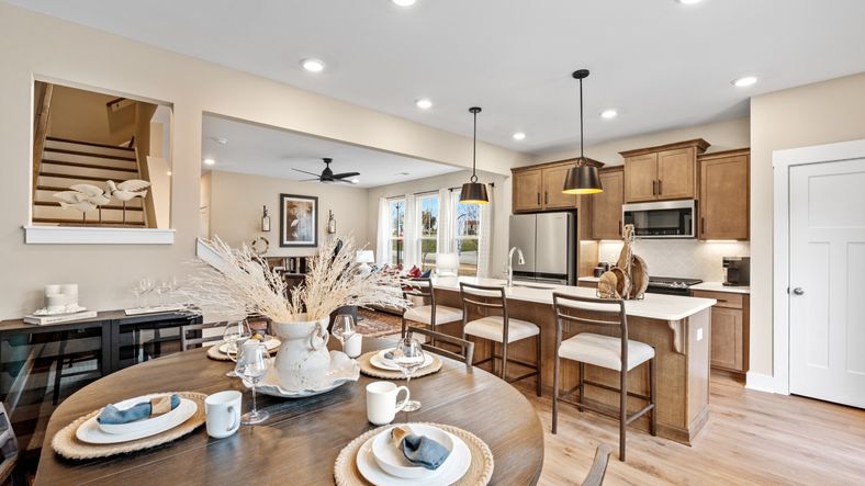 Breakfast area adjacent from kitchen in two story townhome at Saluda Crossing by DRB Homes in Piedmont, SC