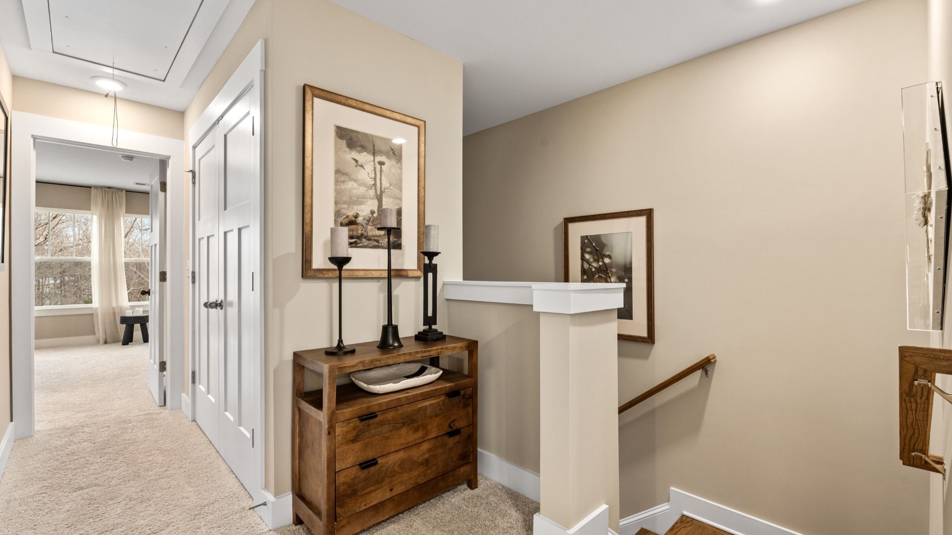 Plush carpeted upstairs landing in two story townhome at Saluda Crossing by DRB Homes in Piedmont, SC
