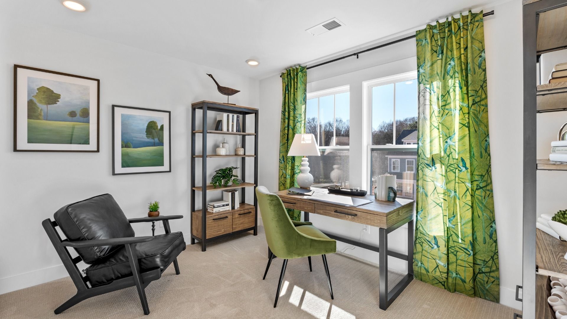 Natural themed, green accented office space with cozy carpeted flooring and large windows at Fox Hollow by DRB Homes