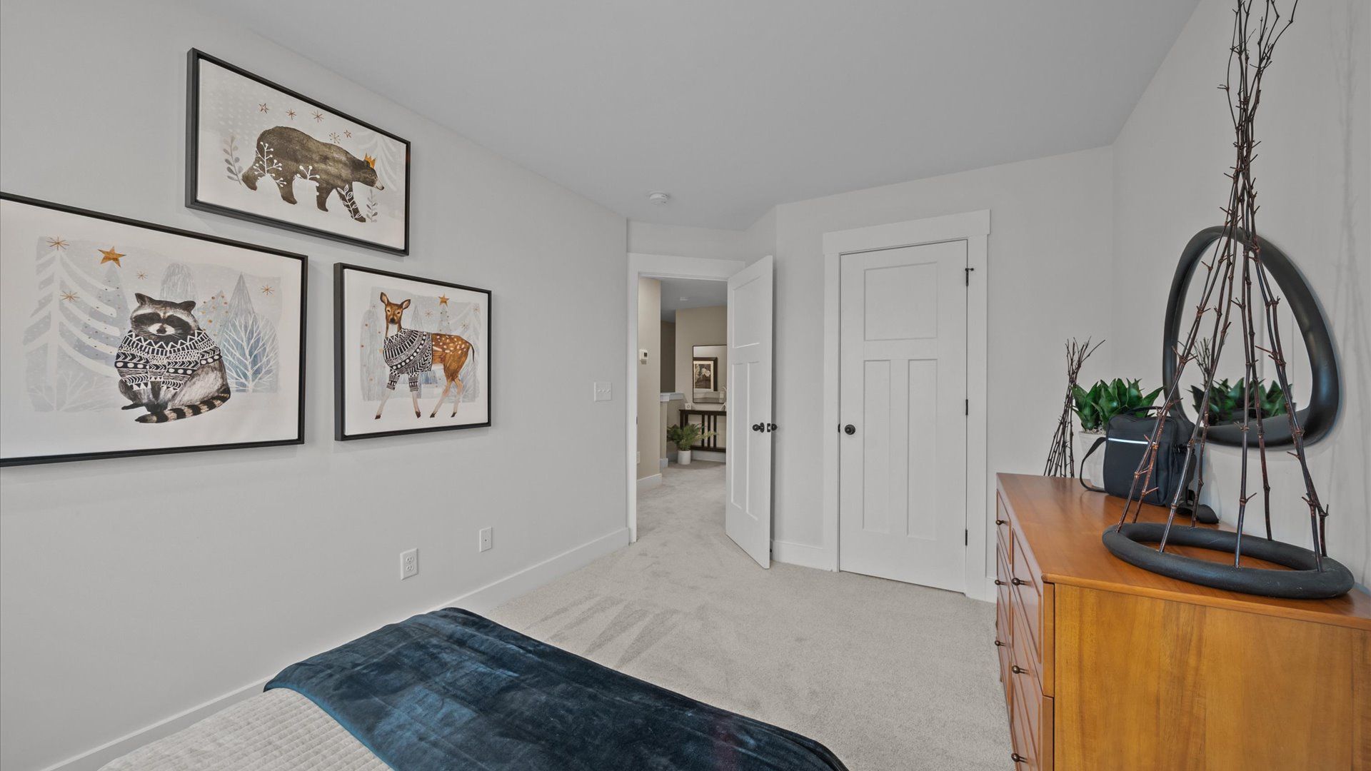 Vibrant and inviting secondary bedroom featuring a walk-in closet and refined finishes