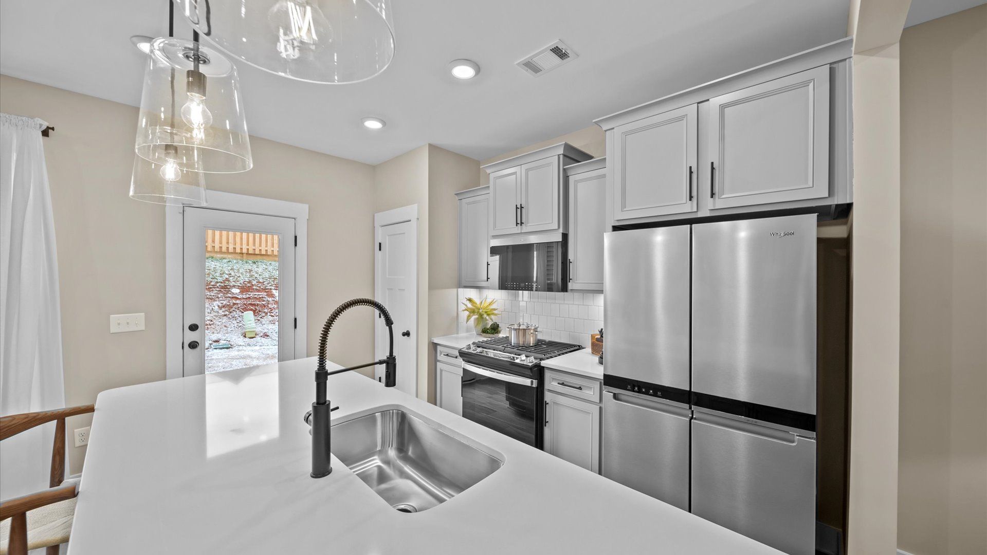 Accomplished layout with a stunning 9-foot island, pendant lighting, and superior craftsmanship